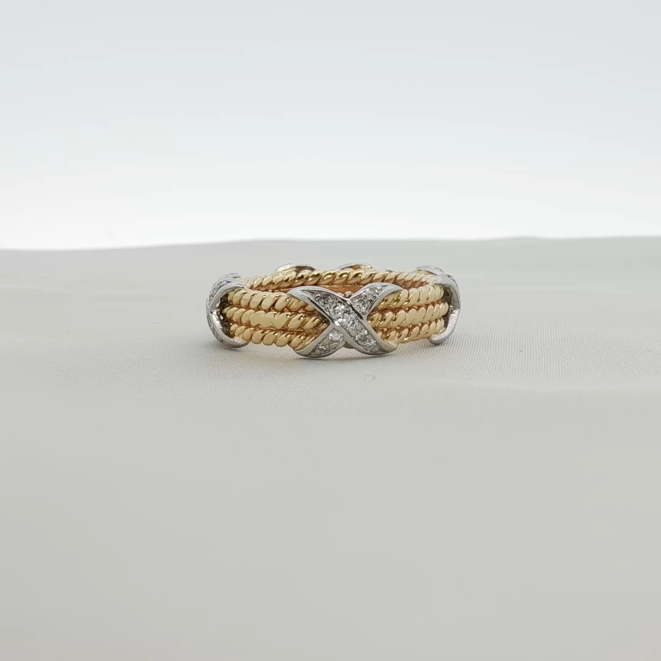 Tiffany & Co. Schlumberger three-row rope diamond ring in gold, showcasing intricate design and sparkling diamonds.