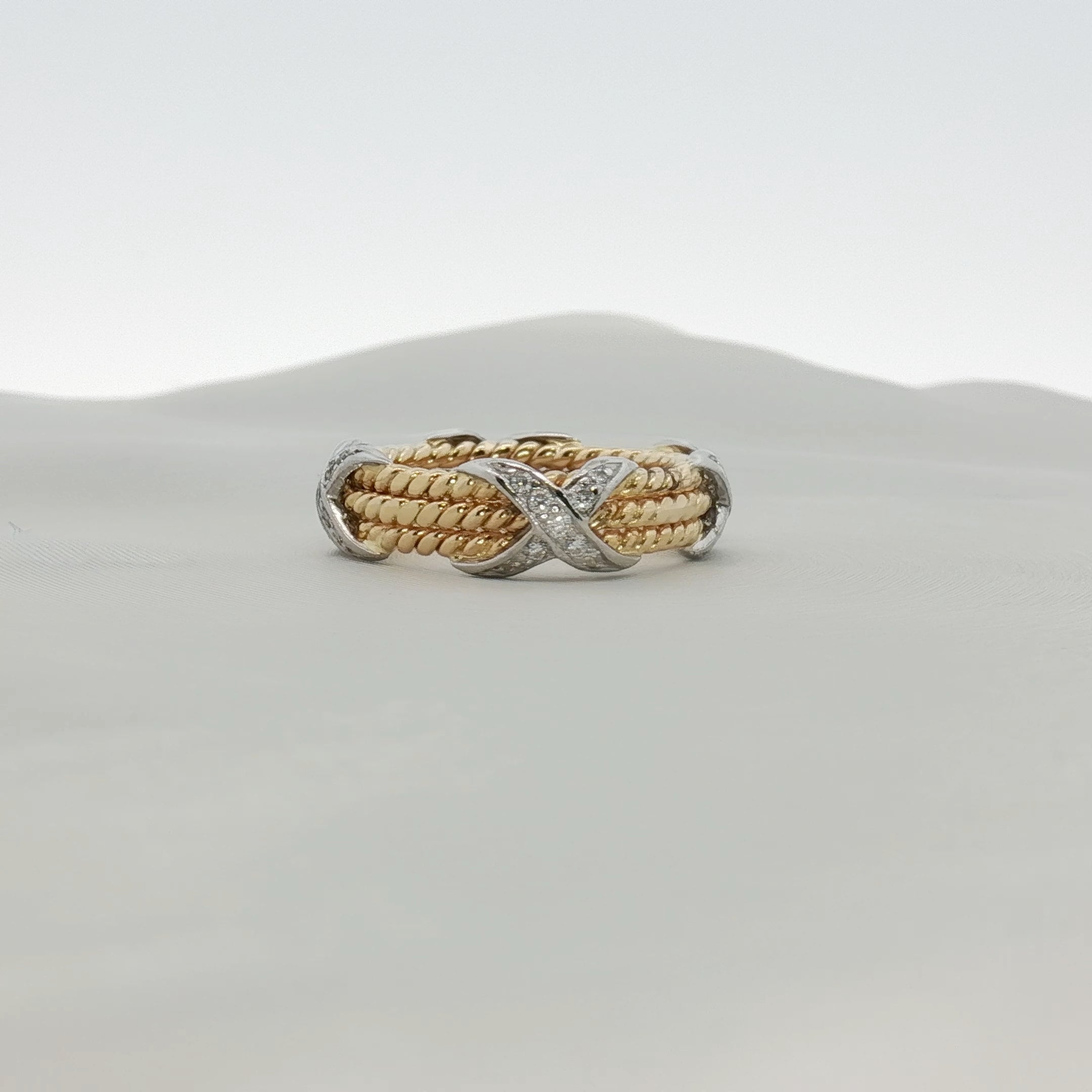 Tiffany & Co. Schlumberger three-row rope diamond ring in gold, featuring intricate diamond-encrusted design and elegant craftsmanship.