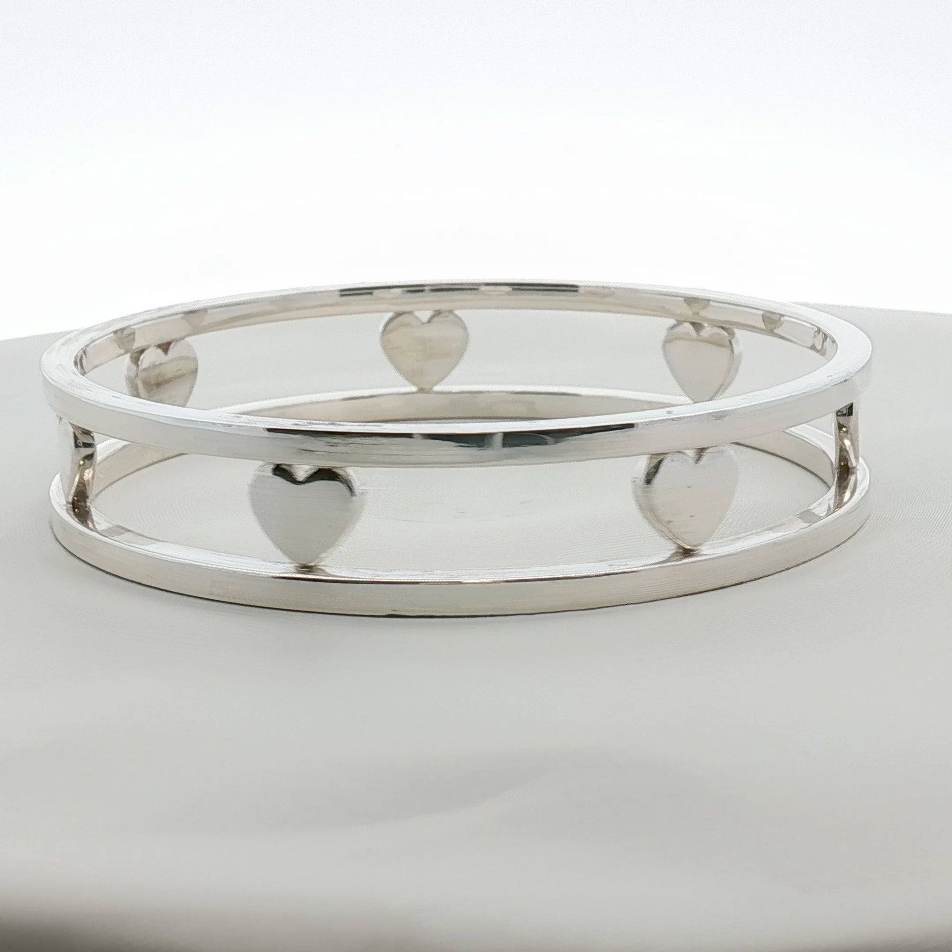Sterling silver Tiffany & Co. heart bracelet with delicate chain, jewelry piece from Gold & Beyond featuring a heart-shaped charm.