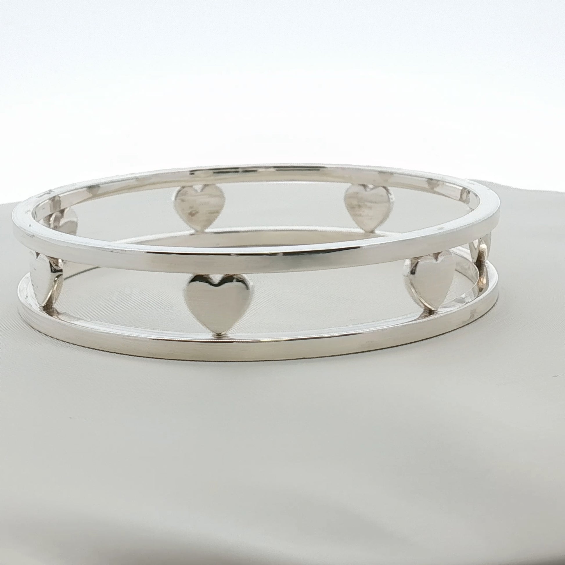 Sterling silver Tiffany & Co. heart bracelet with delicate chain, stylish jewelry piece from Gold & Beyond.
