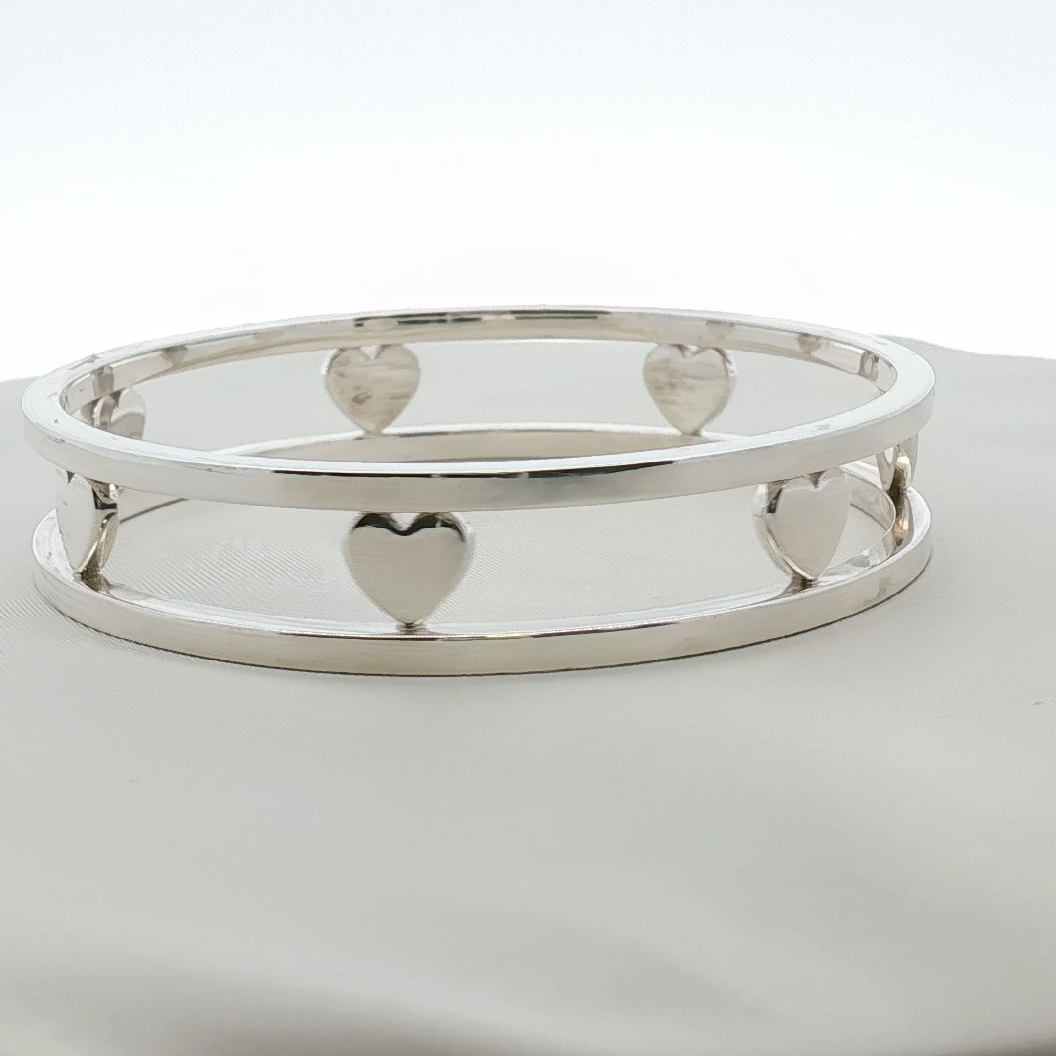 Sterling silver Tiffany & Co. heart bracelet with delicate chain, stylish jewelry piece from Gold & Beyond.