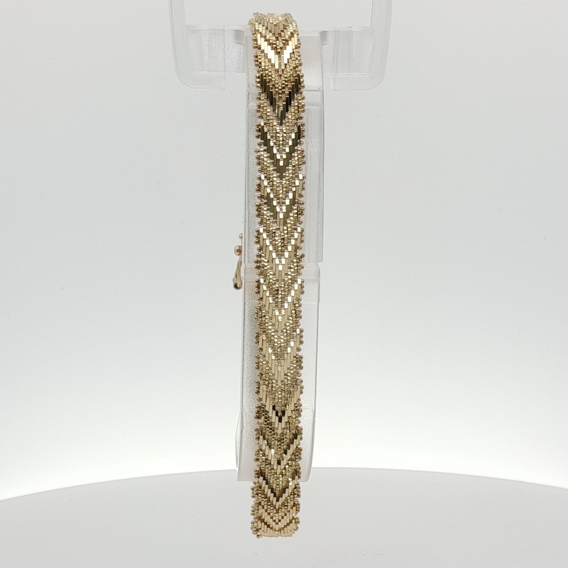 14K yellow gold textured link bracelet featuring interlocking links, designed for elegant jewelry style.