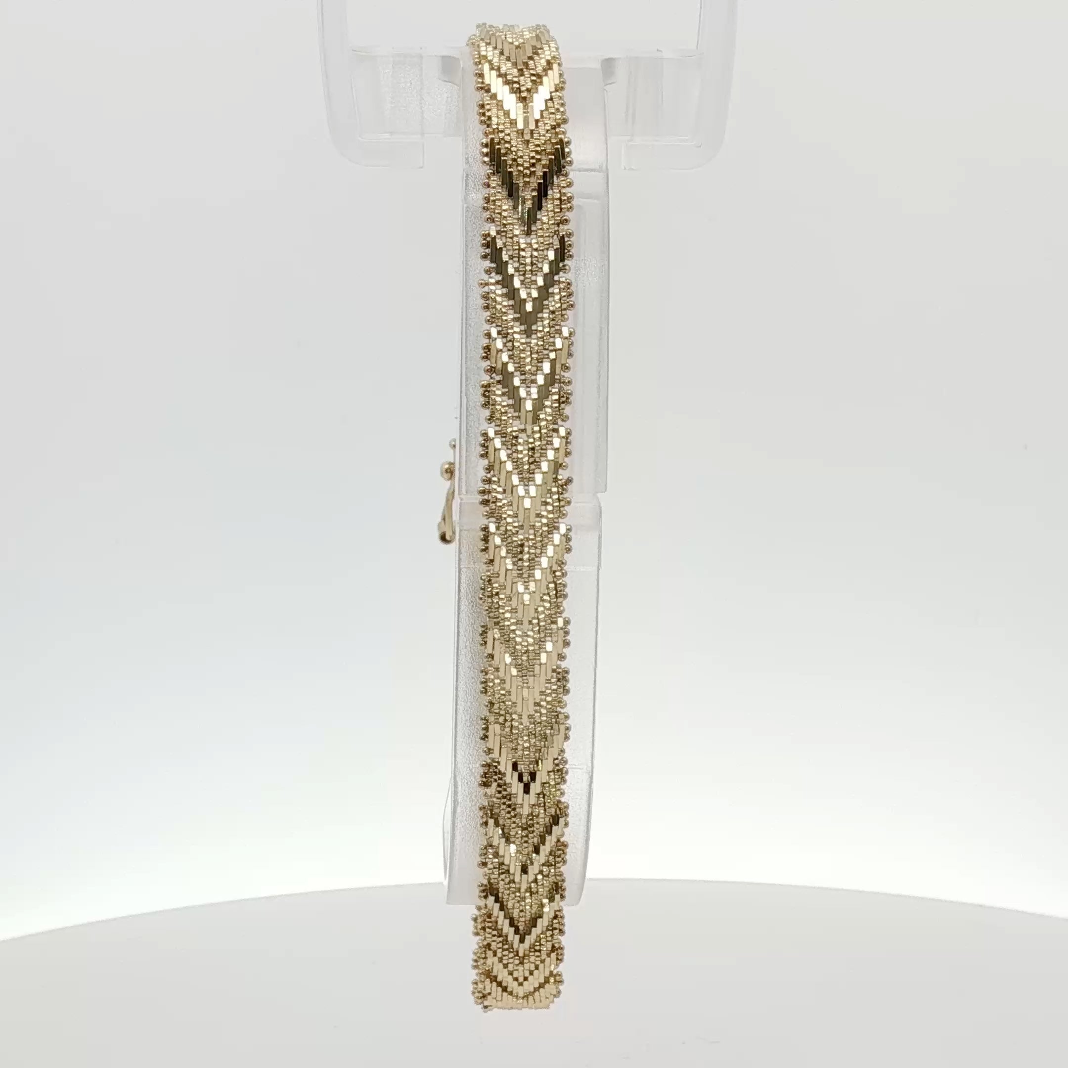 14K yellow gold textured link bracelet from Gold & Beyond featuring interconnected chain links and a polished finish.