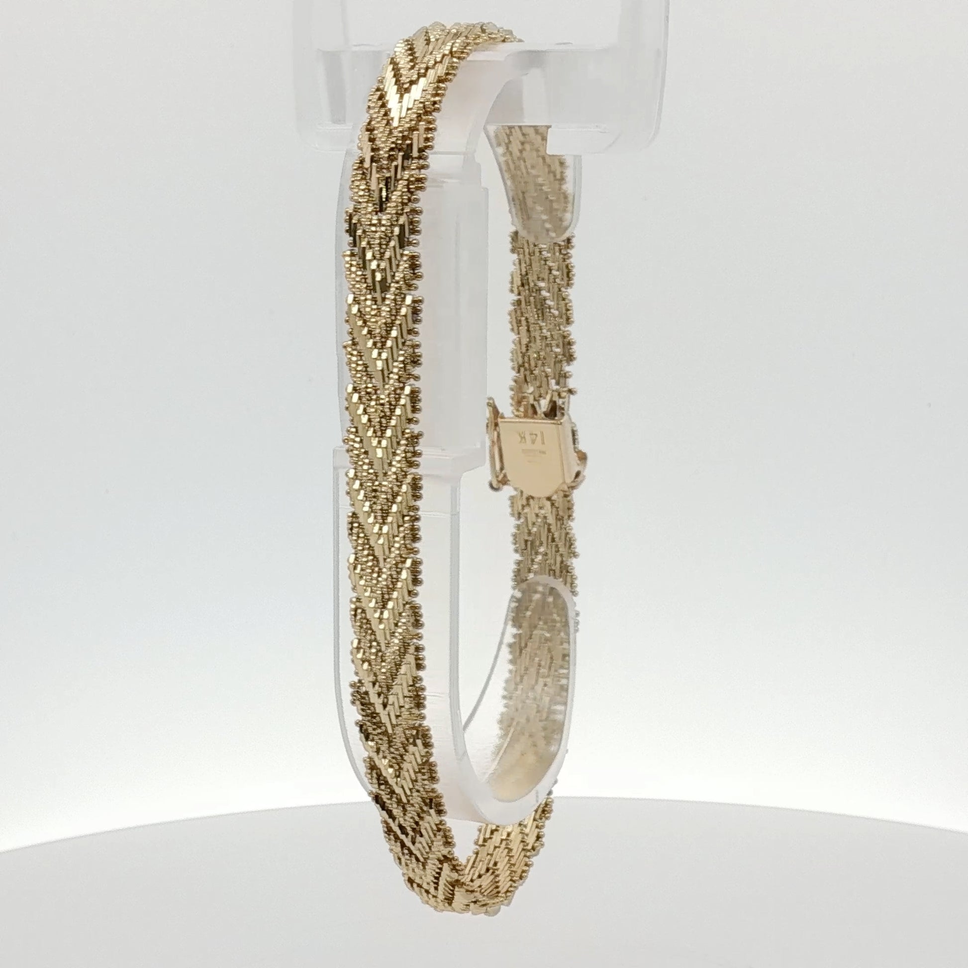 14K yellow gold textured link bracelet with a polished jewelry finish, showcasing interconnected links.