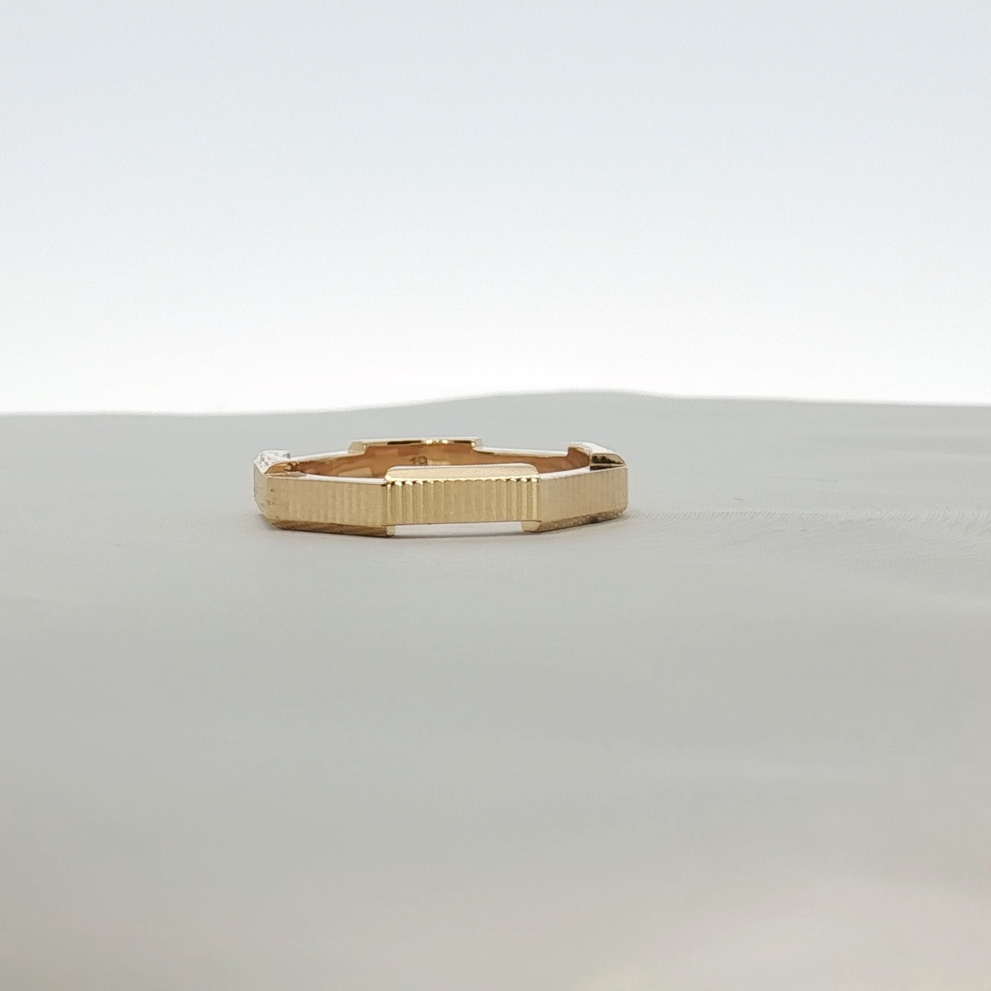 Gucci Link to Love striped jewelry ring featuring red, white, and blue enamel accents on gold-tone band.