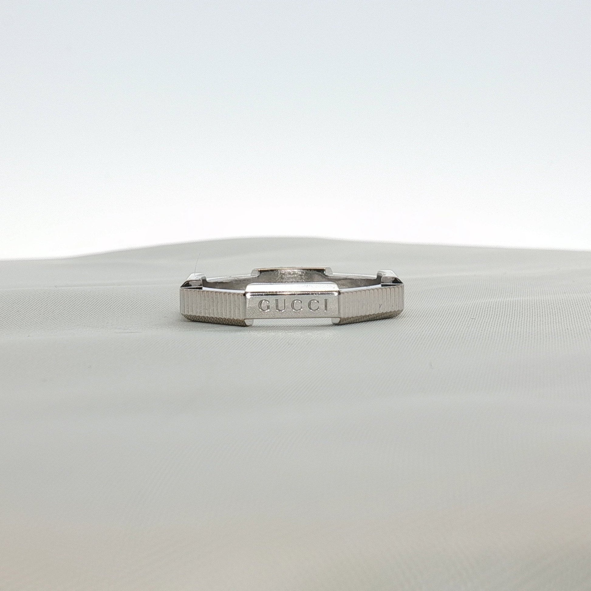 Gold & Beyond Gucci Link Band Ring, elegant jewelry with a polished gold finish and distinctive link design.
