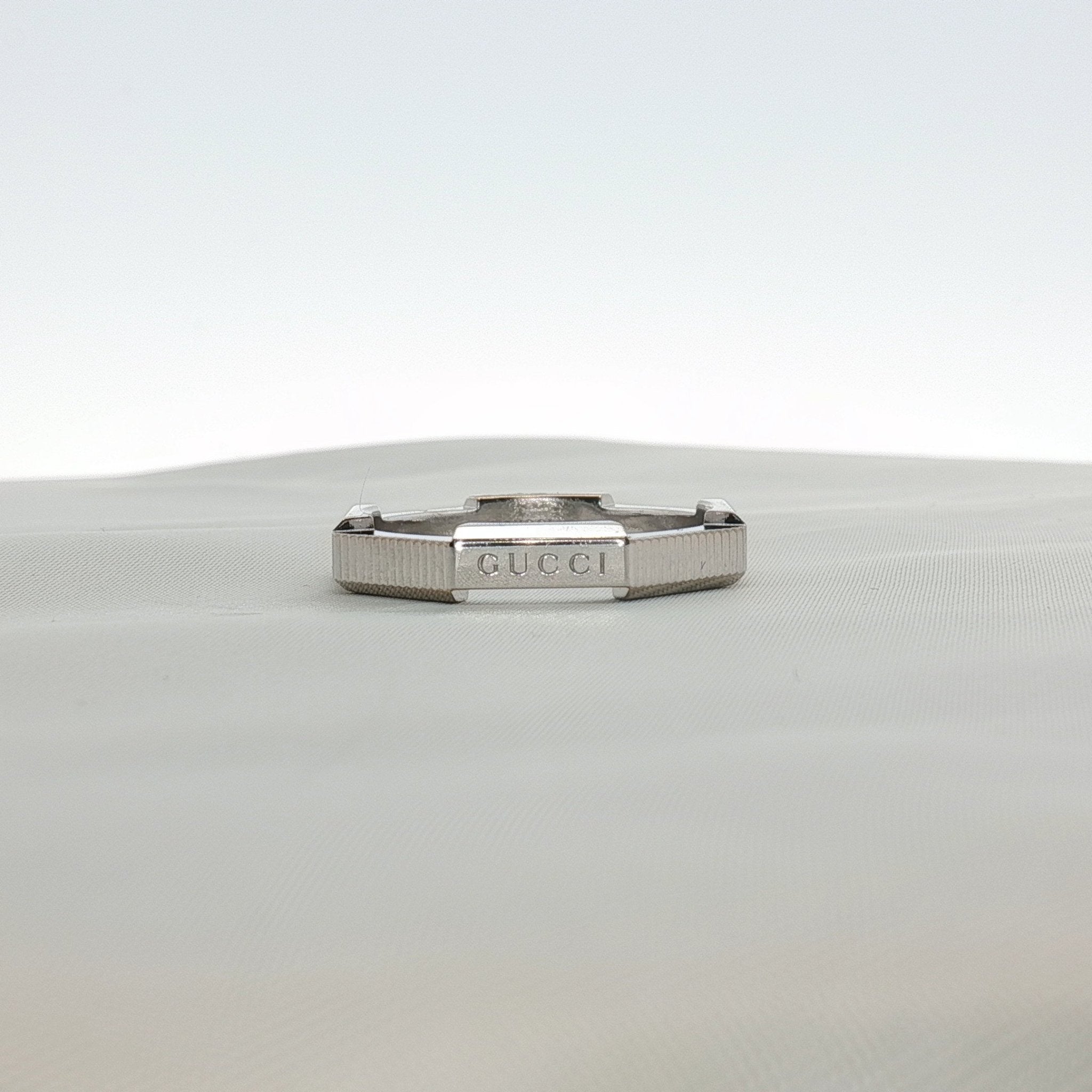 Gold & Beyond Gucci Link Band Ring, elegant jewelry with a polished gold finish and distinctive link design.