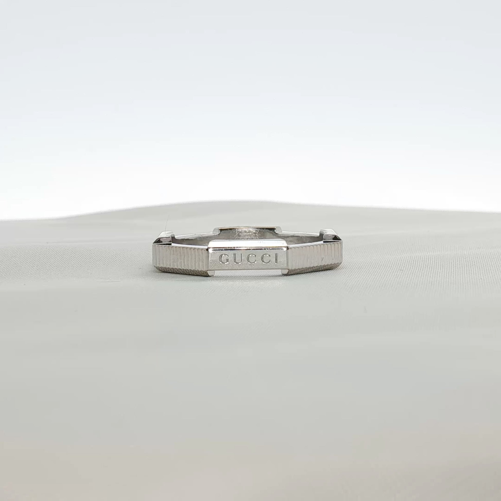 Gold & Beyond Gucci Link Band Ring, elegant jewelry with a distinctive link design, showcasing a stylish gold finish.