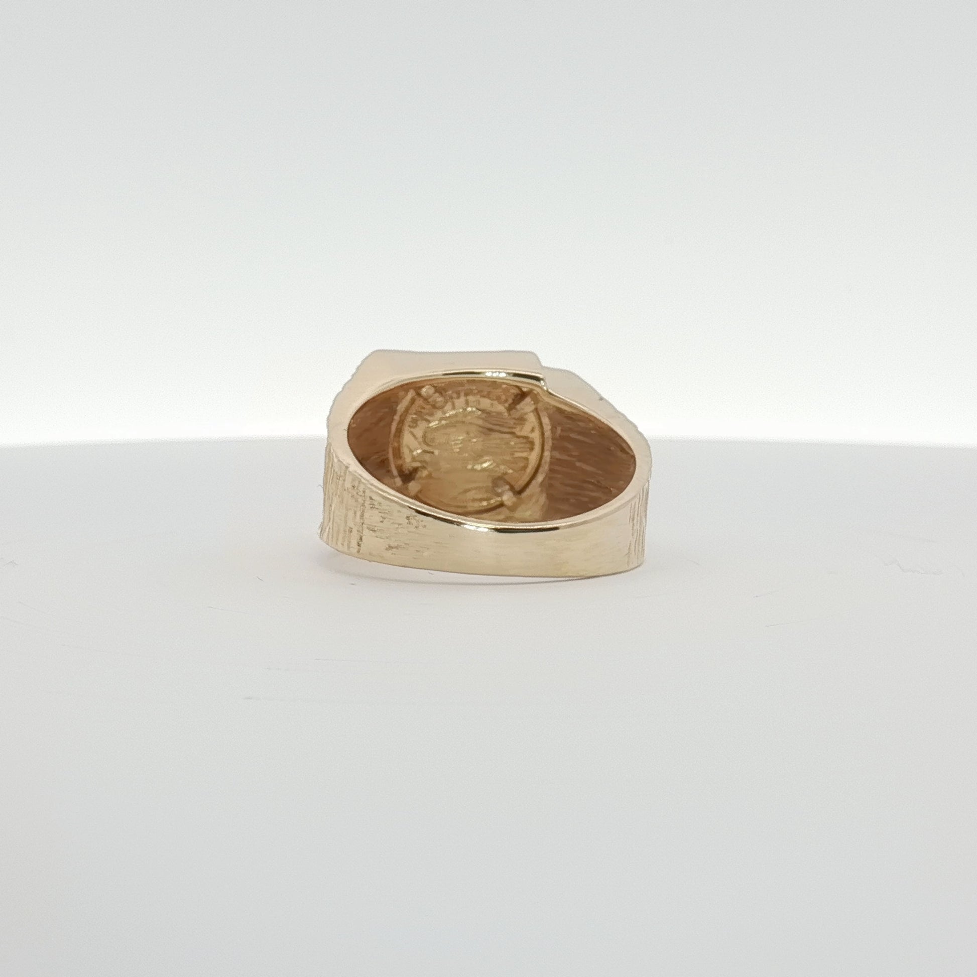 14K yellow gold coin ring from Gold & Beyond, showcasing a detailed gold coin design on a sleek jewelry band.