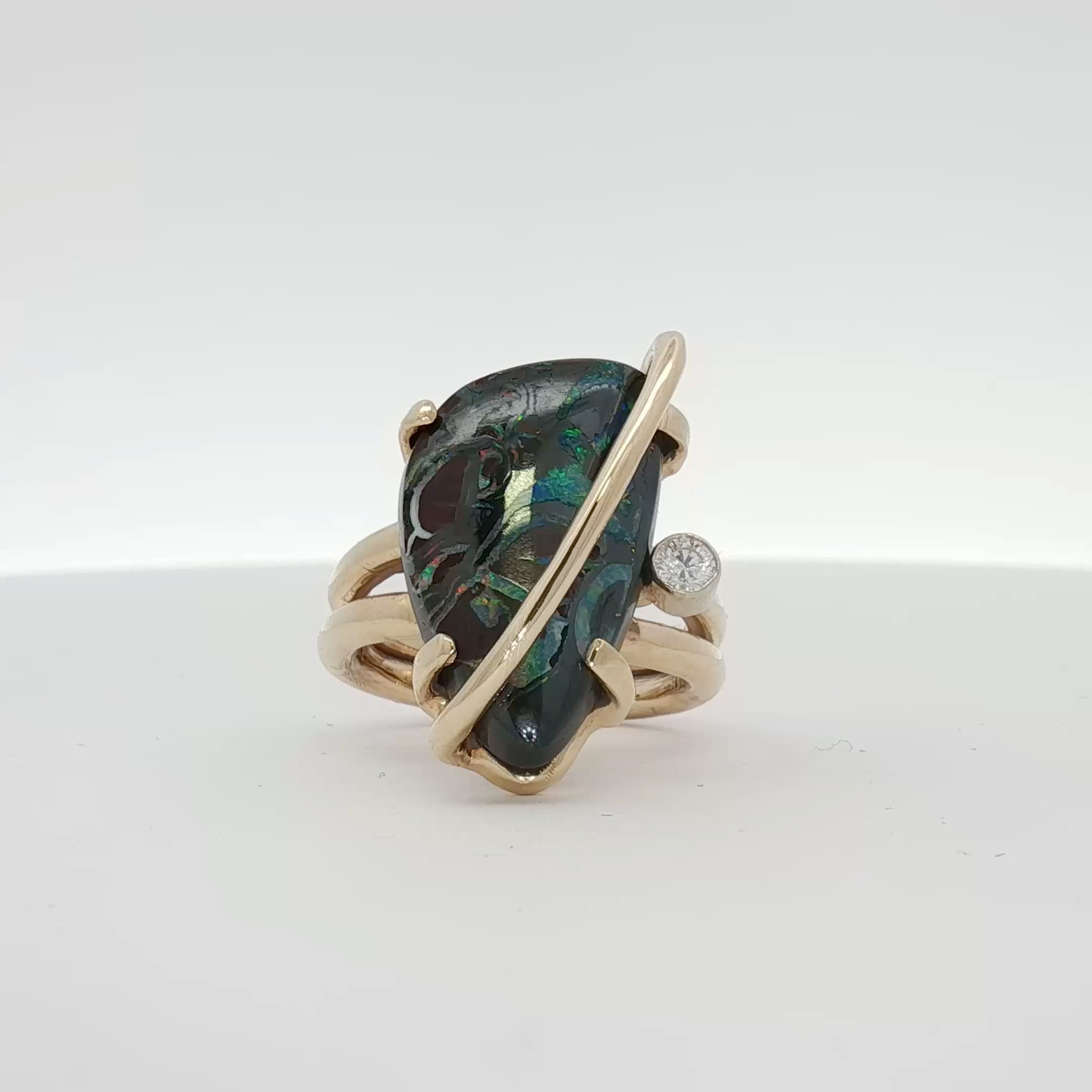 14K yellow gold opal and diamond statement ring from Gold & Beyond, showcasing vibrant opal and sparkling diamonds.