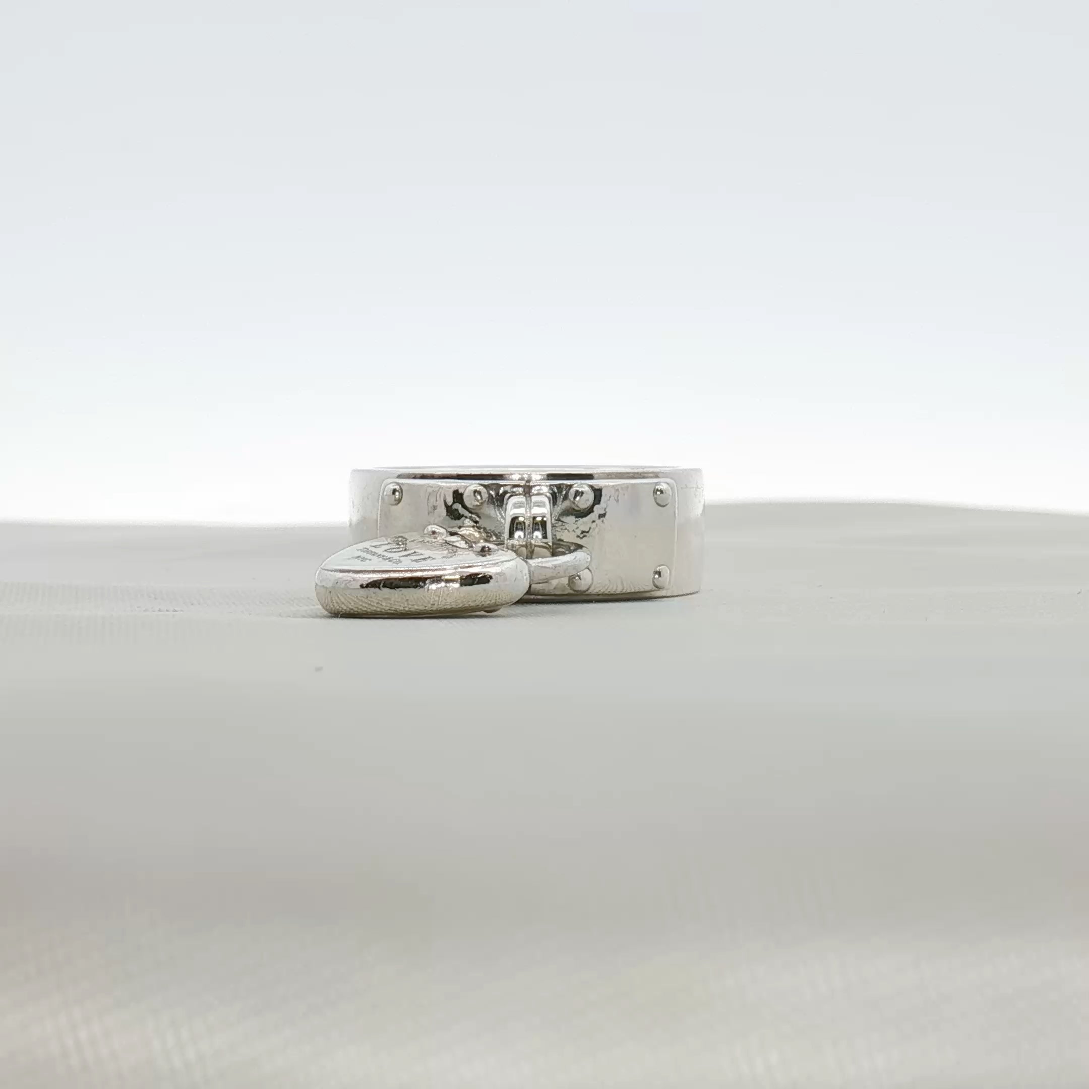 Sterling silver Tiffany & Co. heart-shaped ring with smooth finish, designed by Gold & Beyond, jewelry accessory.