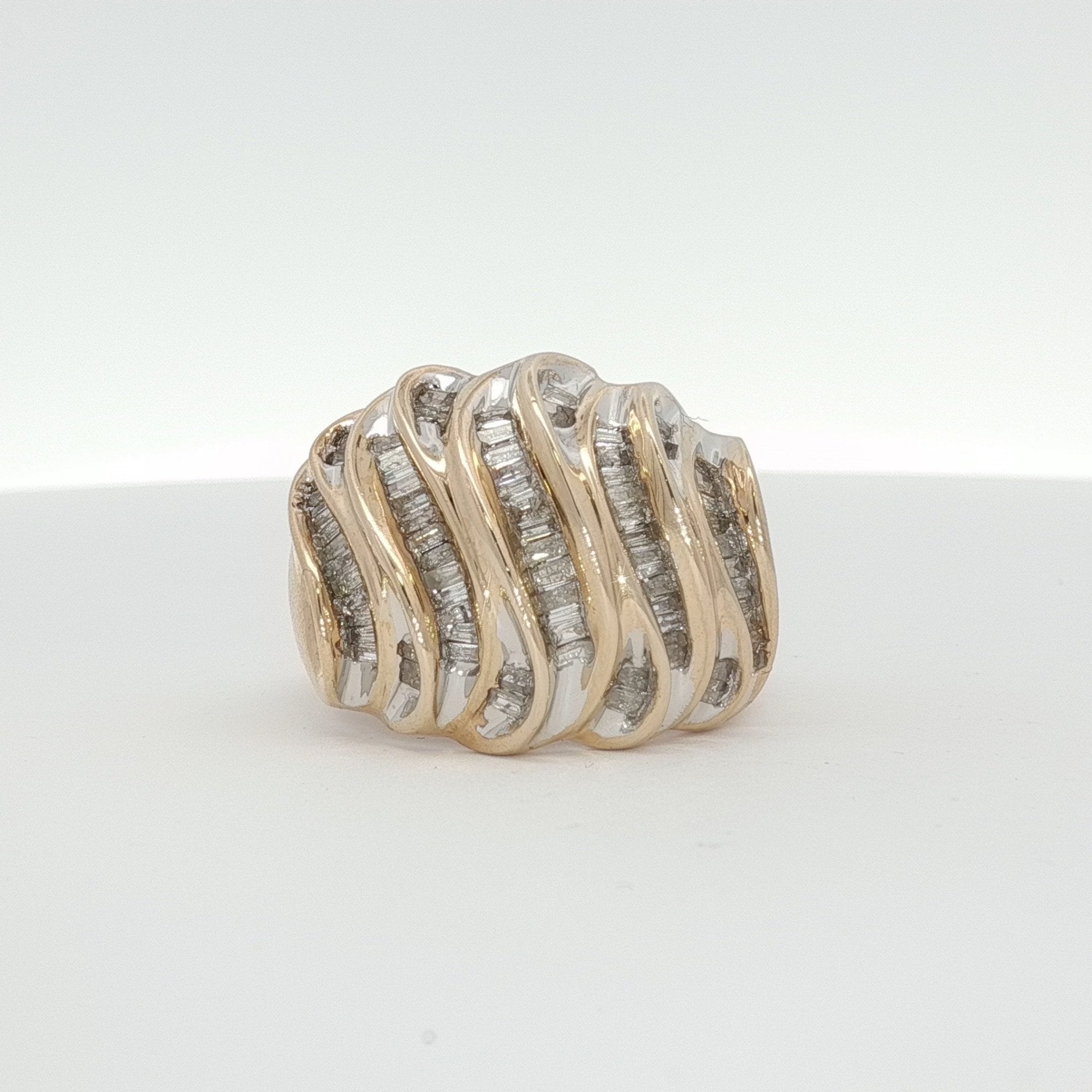 Yellow gold diamond wave cluster ring featuring a sparkling diamond design, crafted by Gold & Beyond.