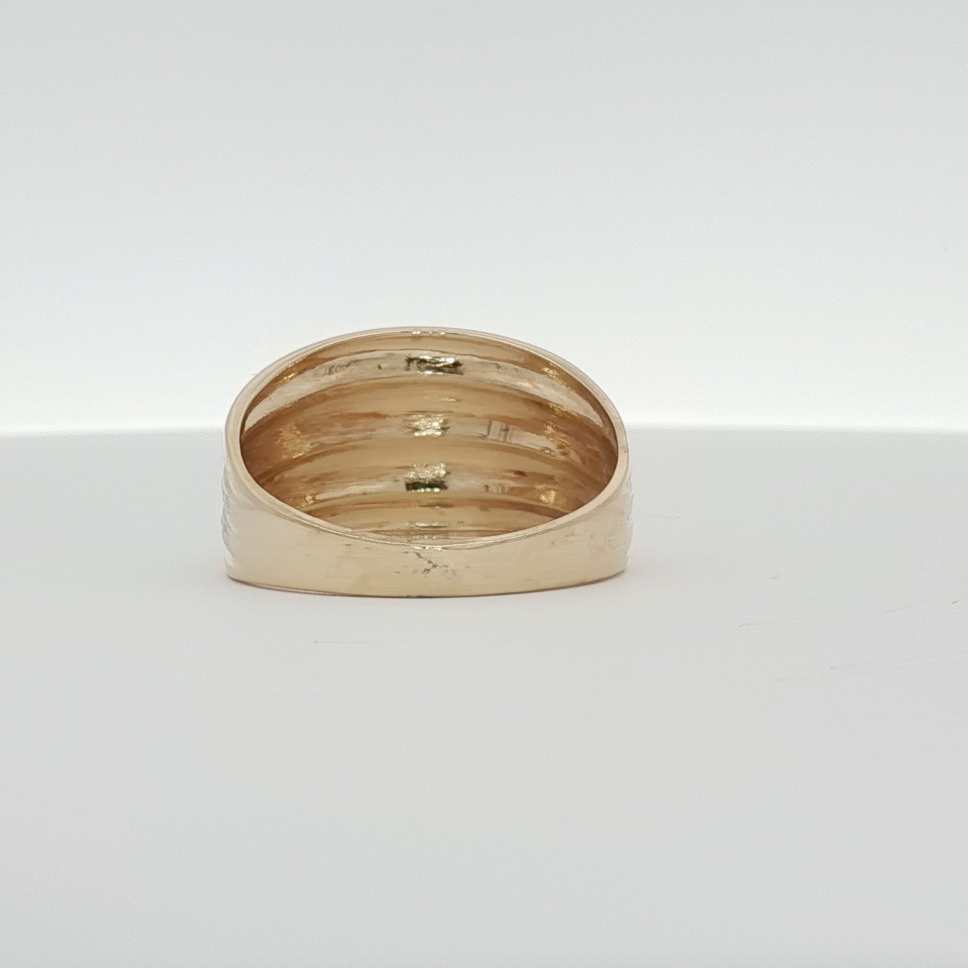 14K gold two-tone ring featuring a sleek design, crafted by Gold & Beyond, showcasing a combination of yellow and white gold.