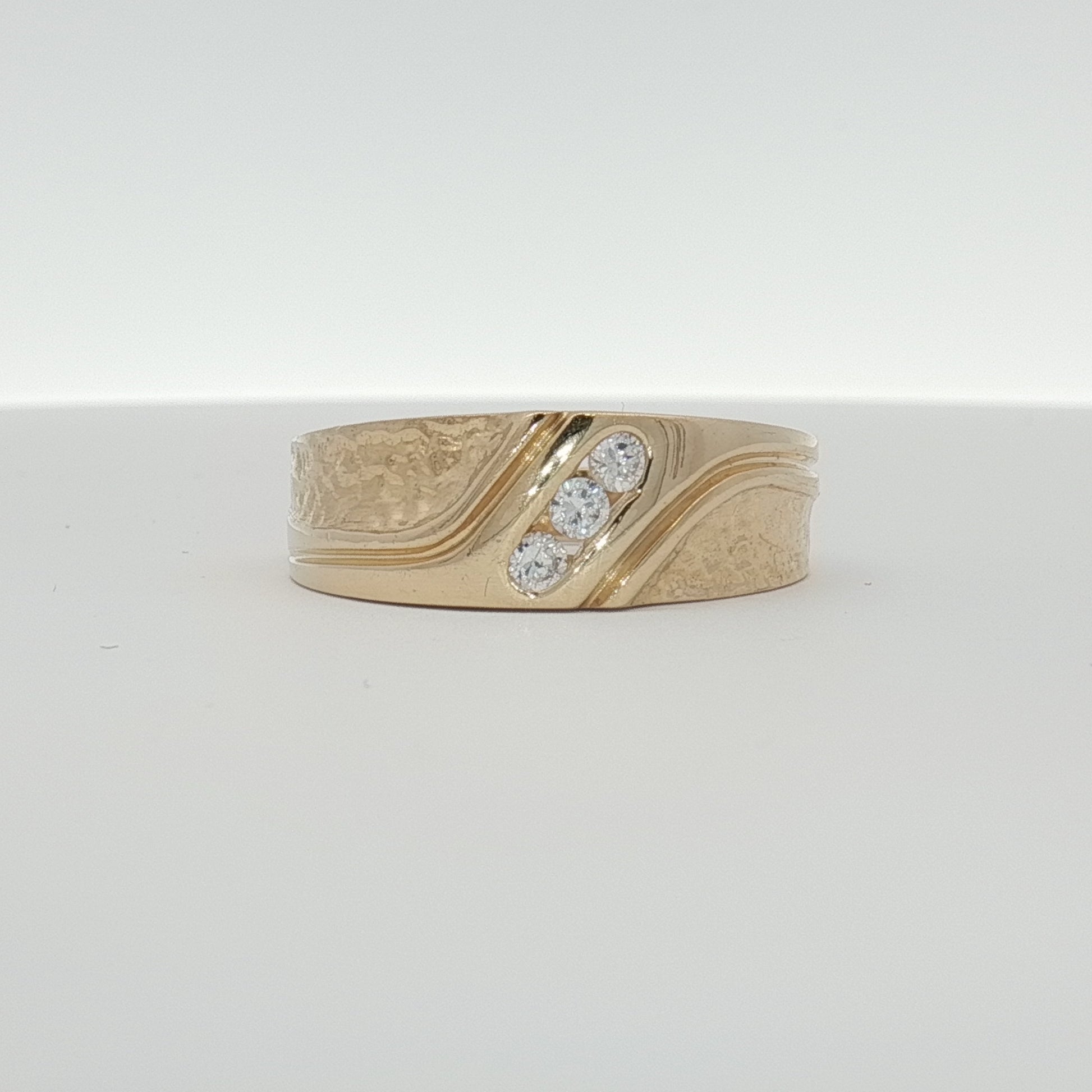 14K yellow gold diamond band ring with sparkling diamonds, showcasing elegant jewelry craftsmanship by Gold & Beyond.