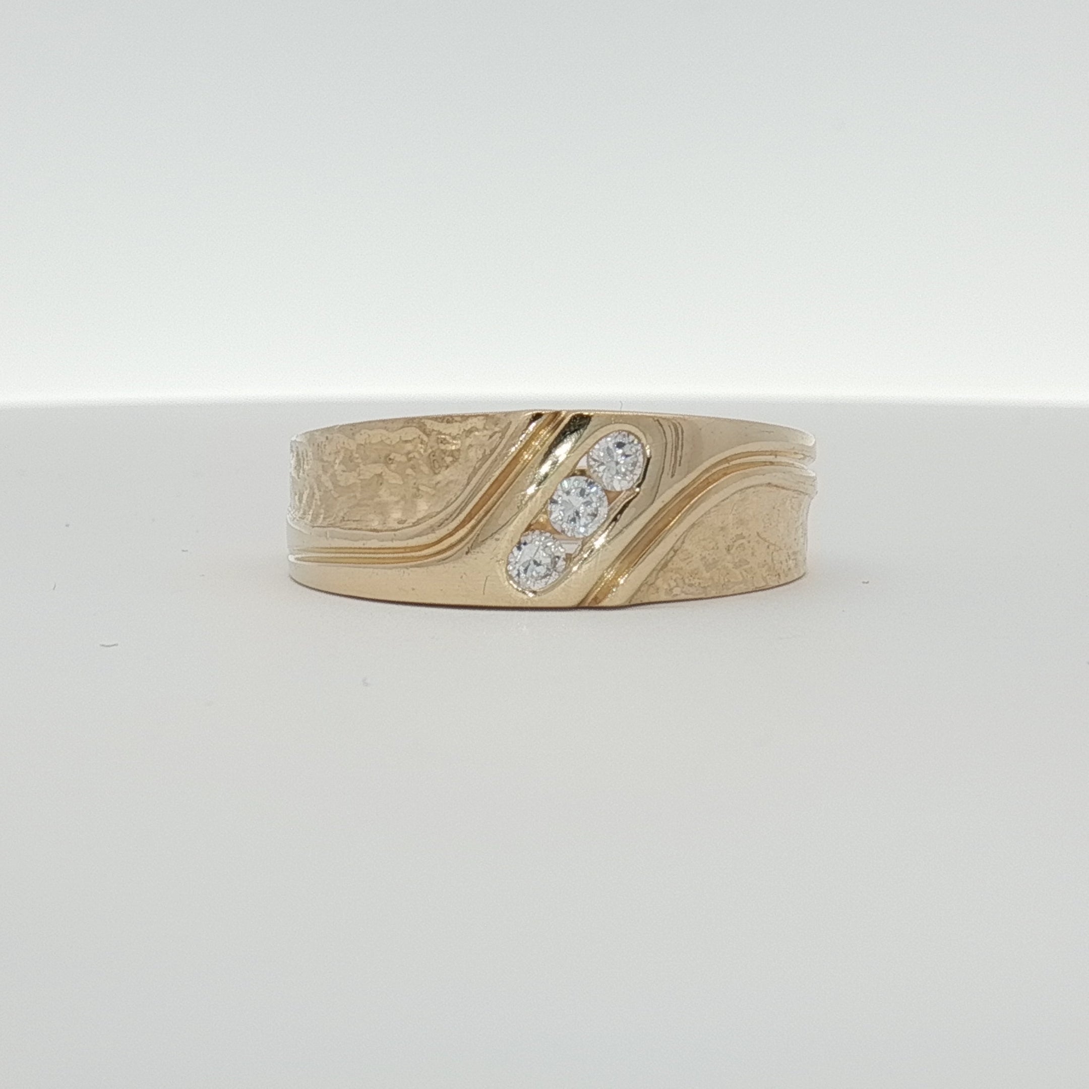 14K yellow gold diamond band ring with sparkling diamonds, showcasing elegant jewelry craftsmanship.