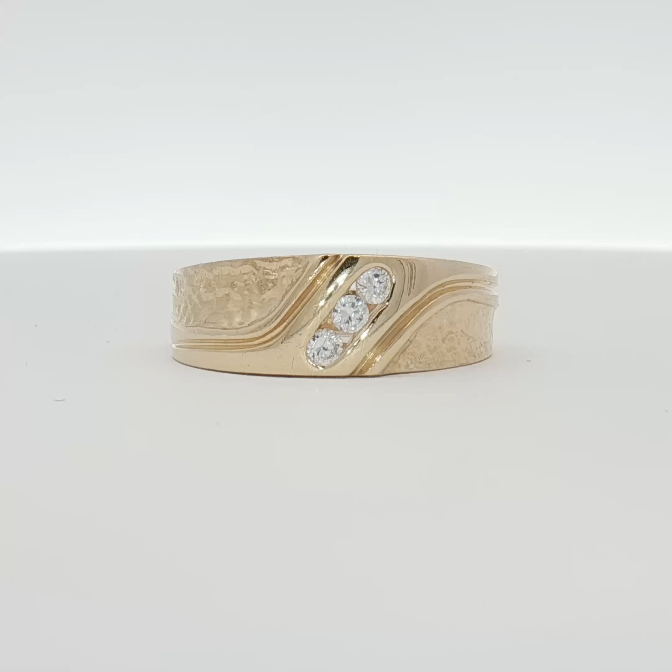 14K yellow gold diamond band ring with sparkling diamonds, crafted by Gold & Beyond, showcasing elegant jewelry design.