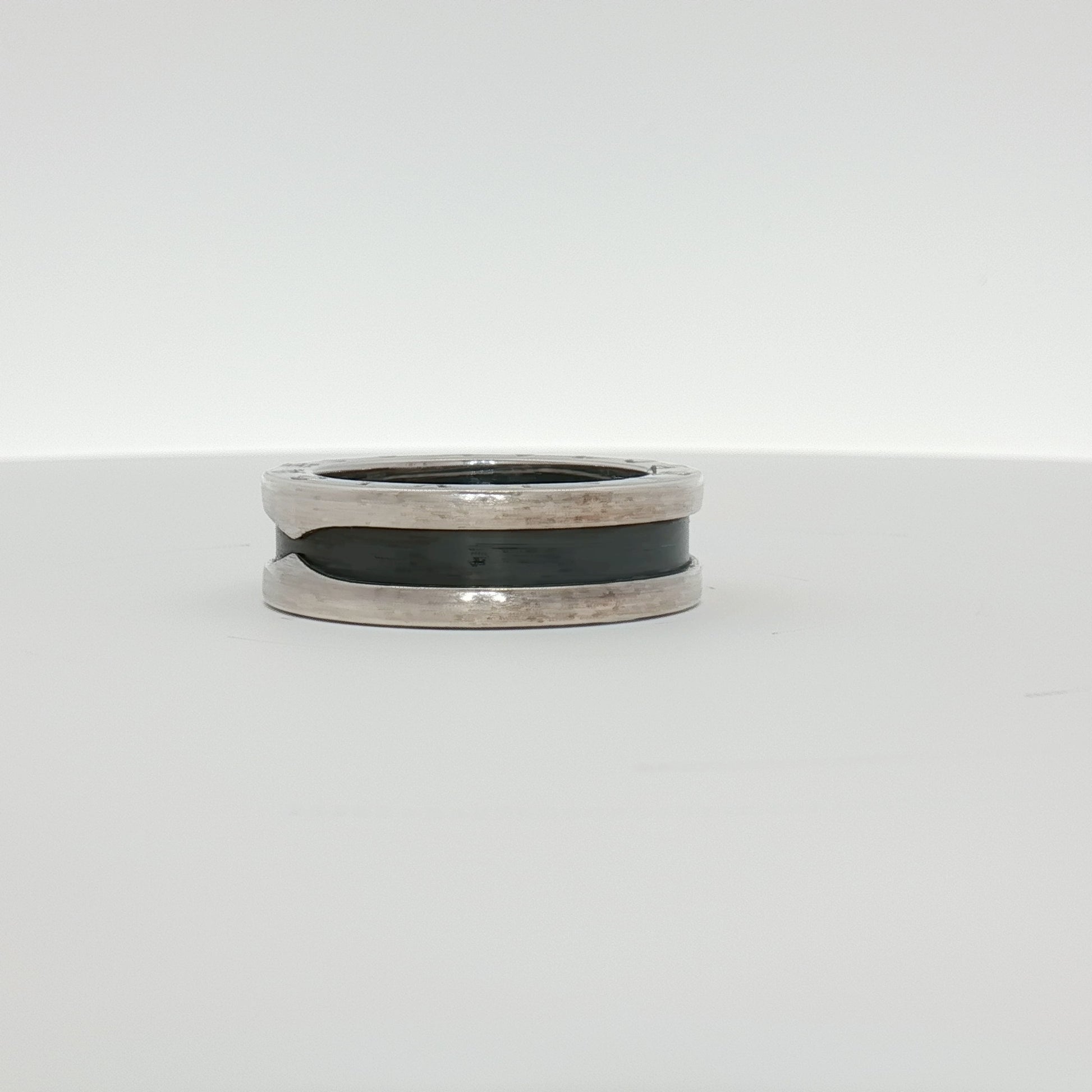 Gold & Beyond Bulgari Save the Children jewelry ring with intricate design and precious metal finish.