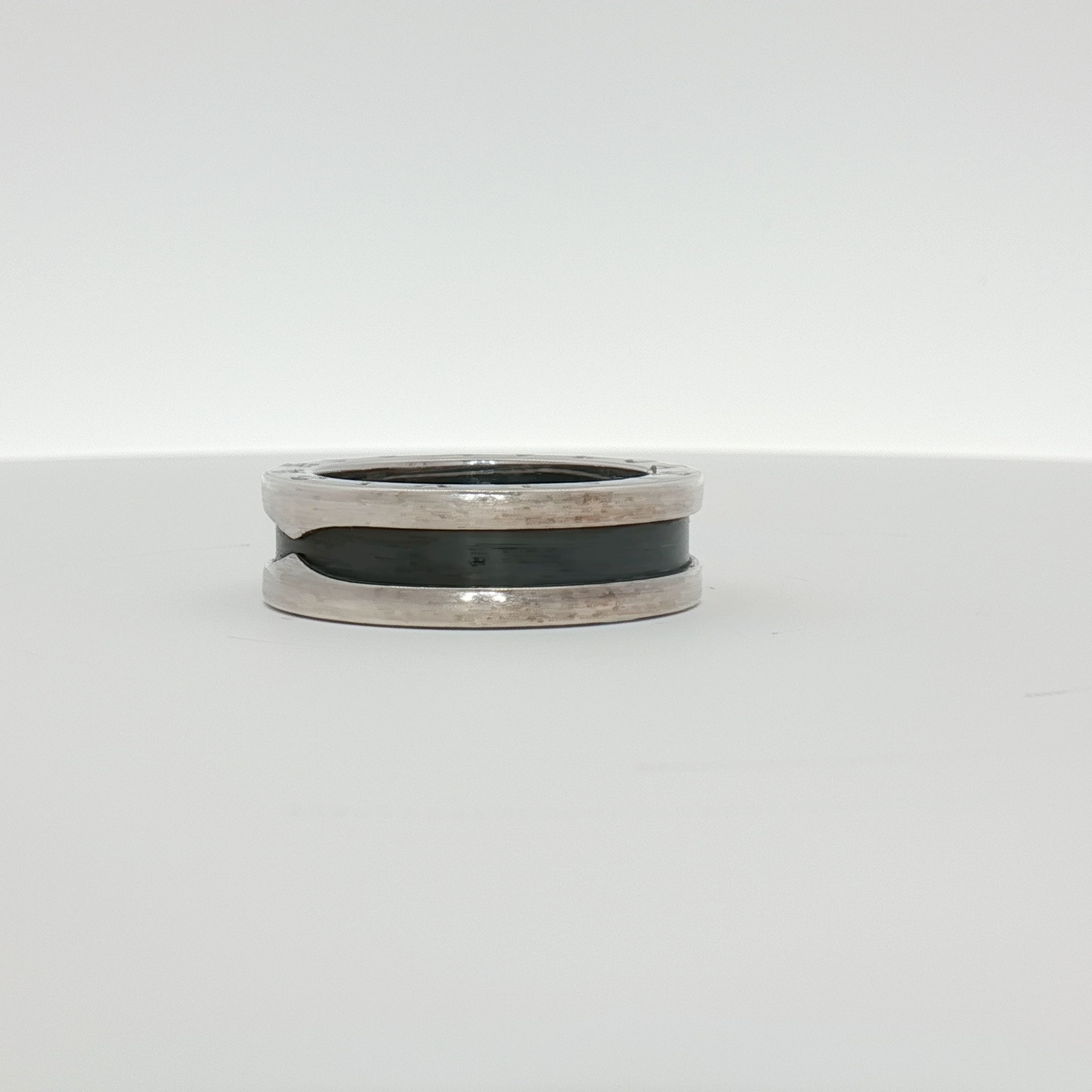 Gold & Beyond Bulgari Save the Children jewelry ring with intricate design and precious metal finish.