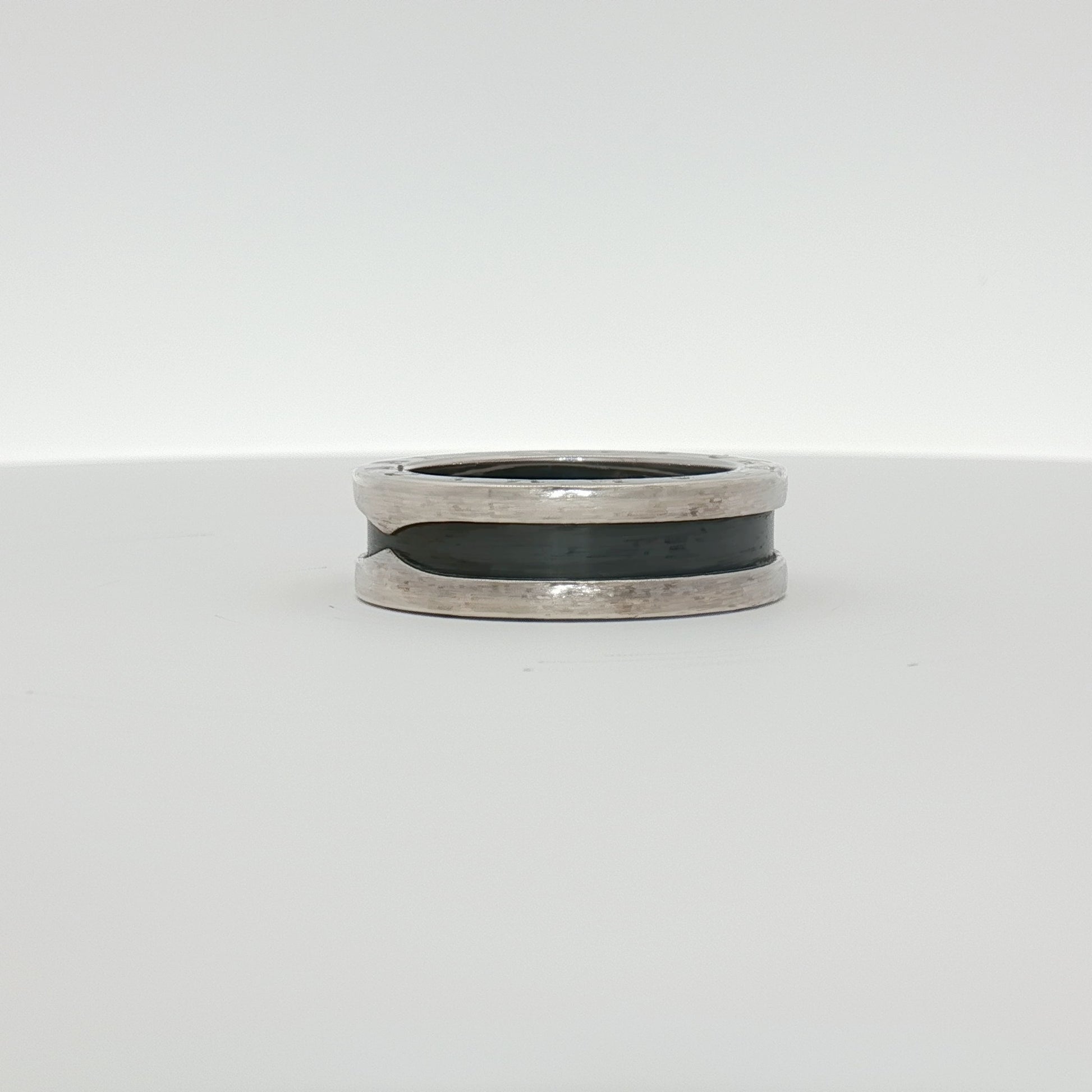Gold & Beyond Bulgari Save the Children jewelry ring featuring a sleek gold band with engraved detailing.