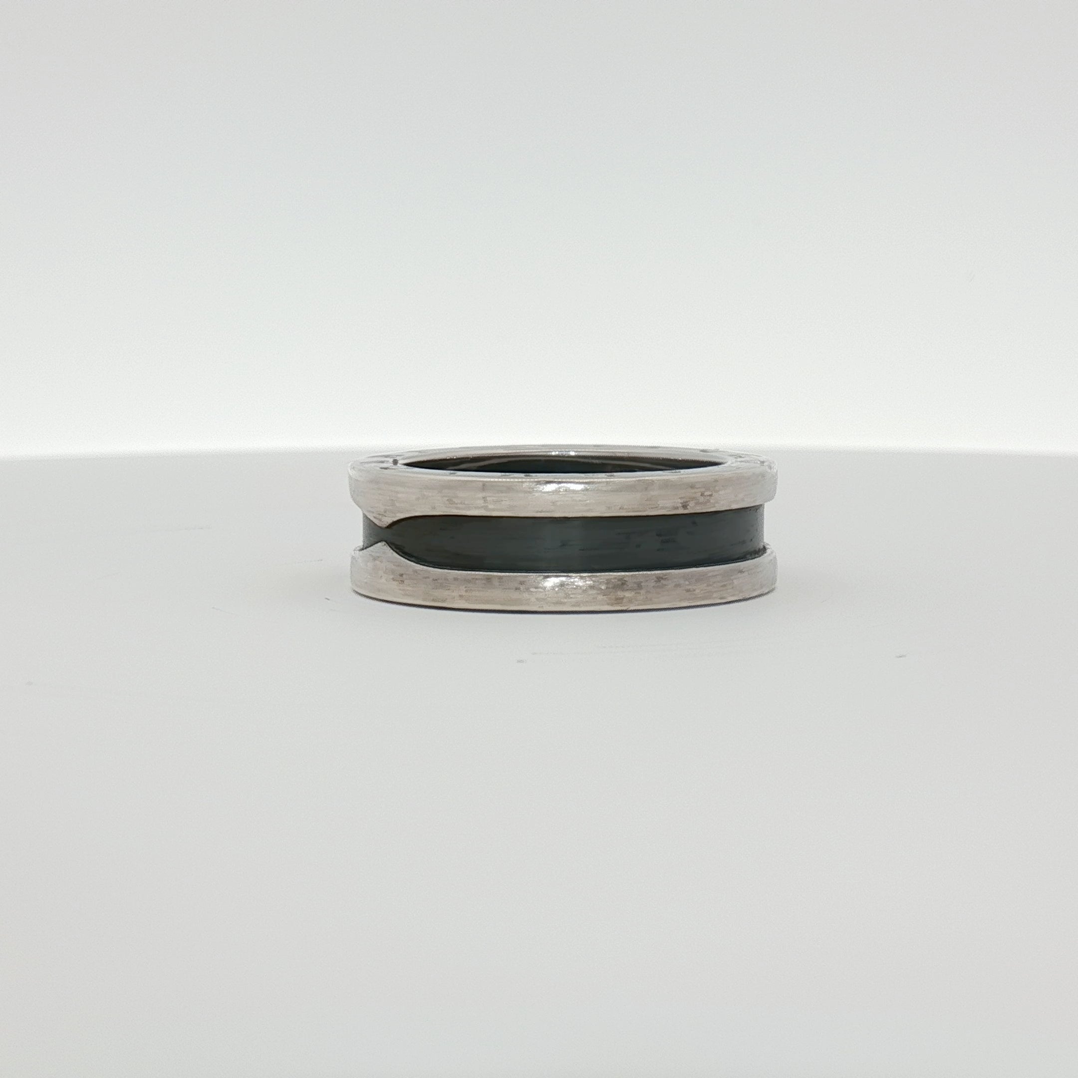 Gold & Beyond Bulgari Save the Children jewelry ring featuring a sleek gold band with engraved detailing.
