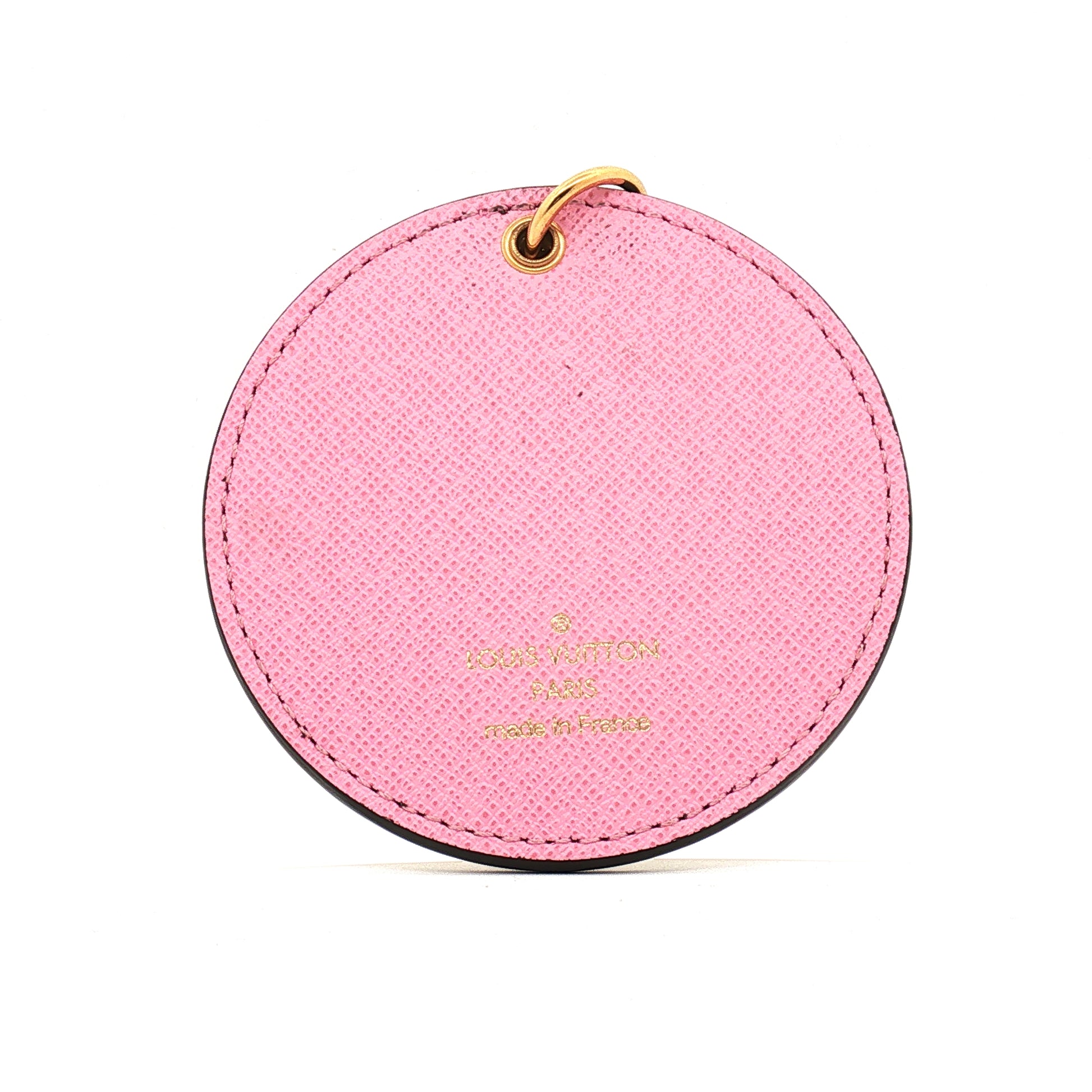 Louis Vuitton Illustre Christmas Paris bag charm and key holder, gold-tone accessories with festive design, by Gold & Beyond.