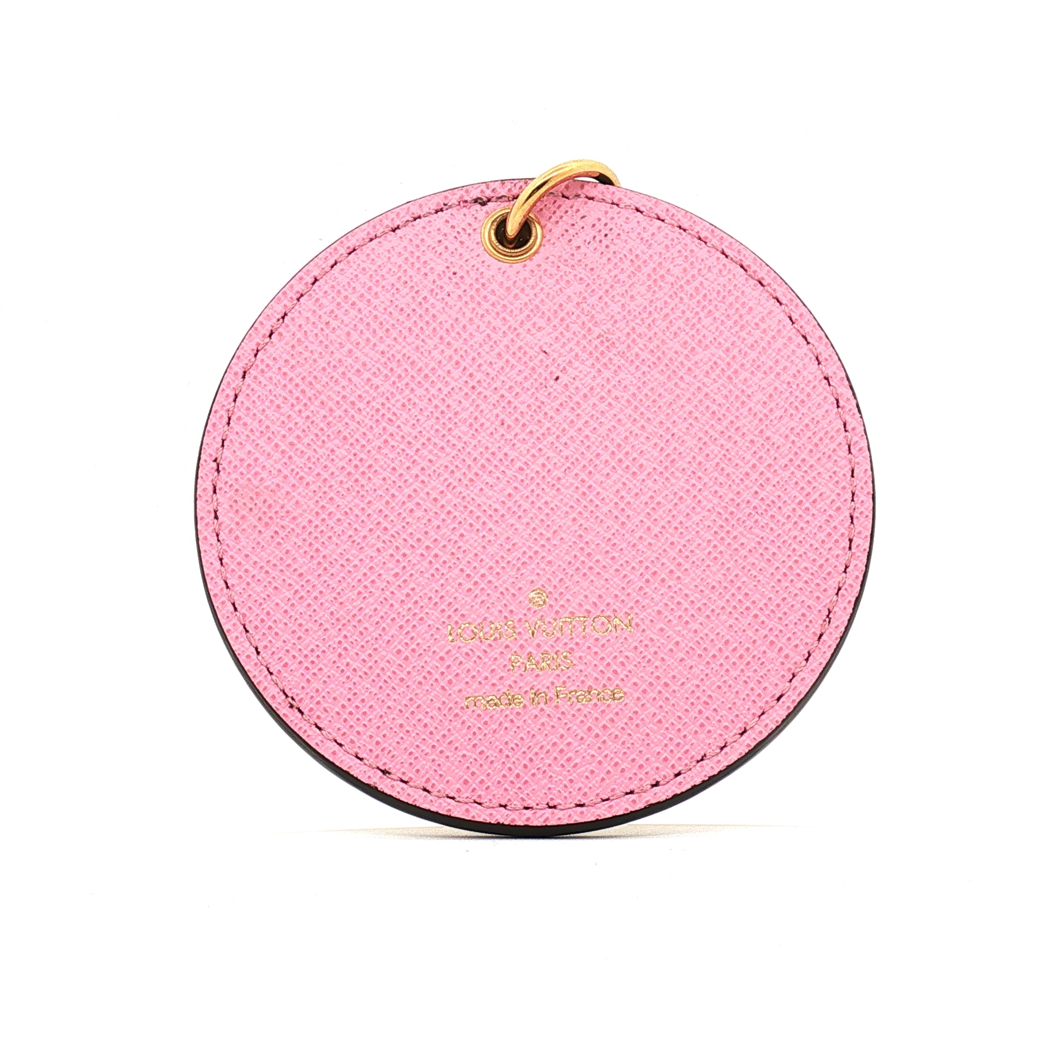 Louis Vuitton Illustre Christmas Paris bag charm and key holder, gold-tone accessories with festive design, by Gold & Beyond.