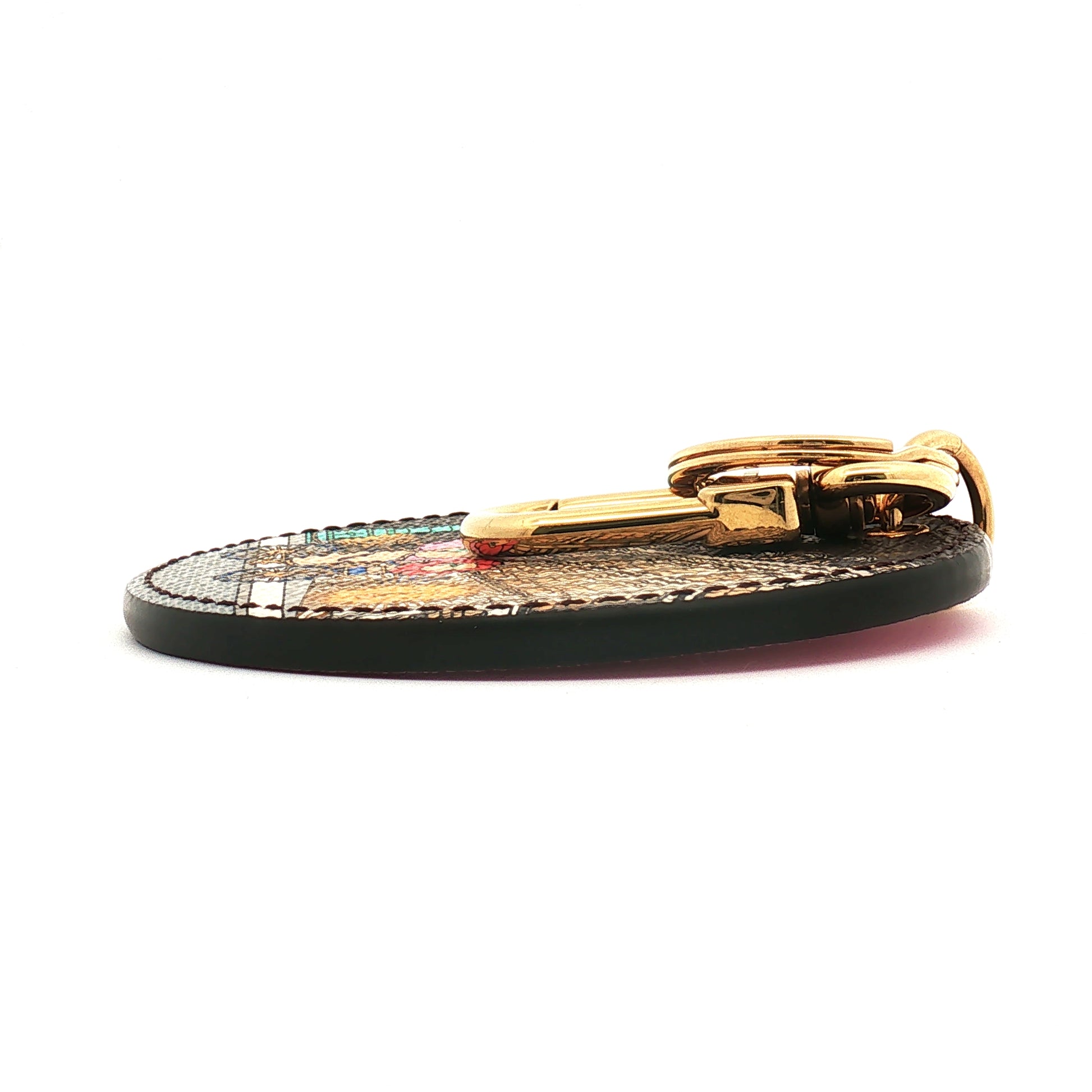 Louis Vuitton Illustre Christmas Paris bag charm and key holder with festive design, gold accents, and detailed Paris-themed artwork.