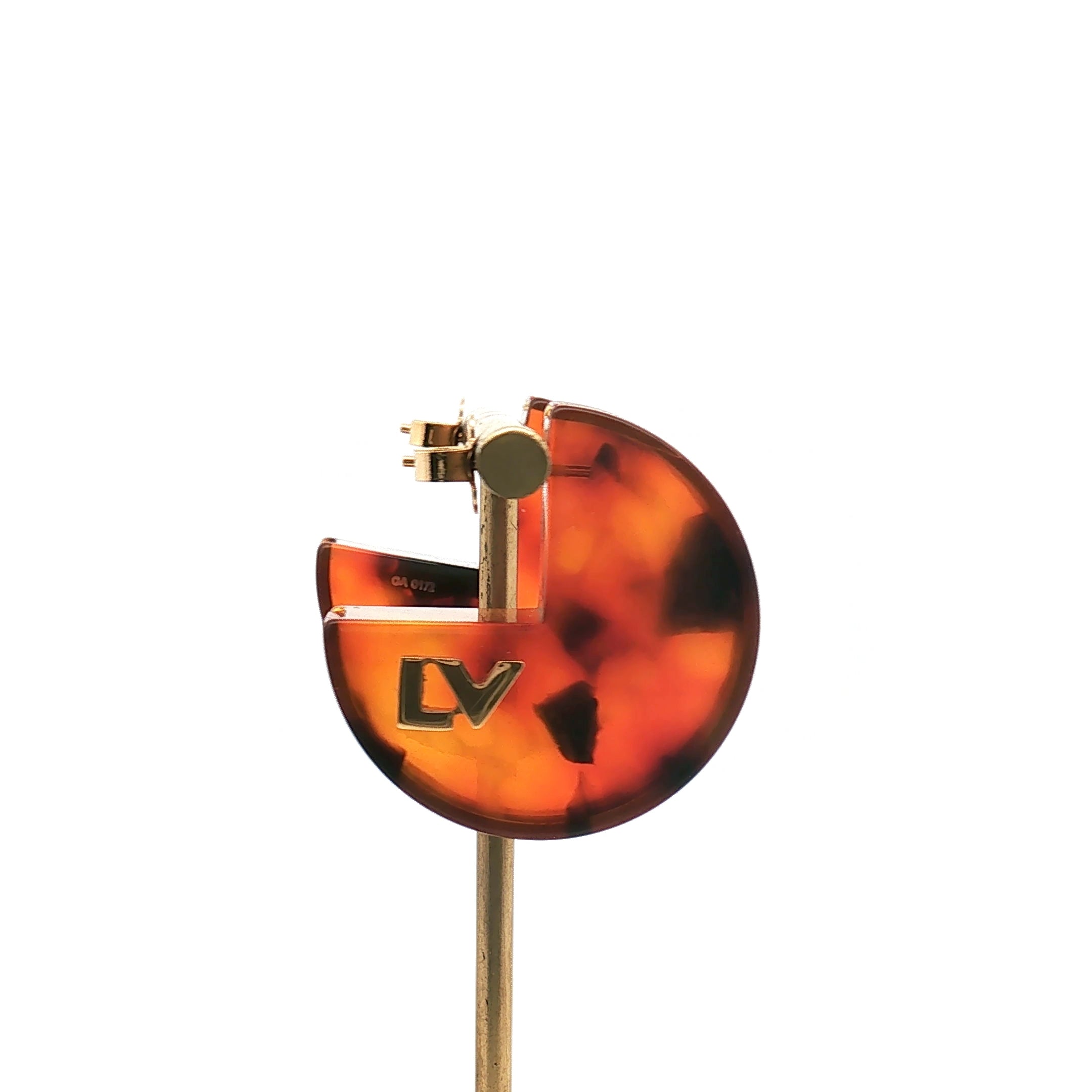 Louis Vuitton tortoise resin hoop earrings, stylish jewelry with gold-tone accents, shown on a white background.