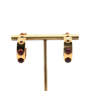 Louis Vuitton gold-tone red resin hoop earrings, jewelry featuring bold circular design with shiny gold finish and vibrant red accents.