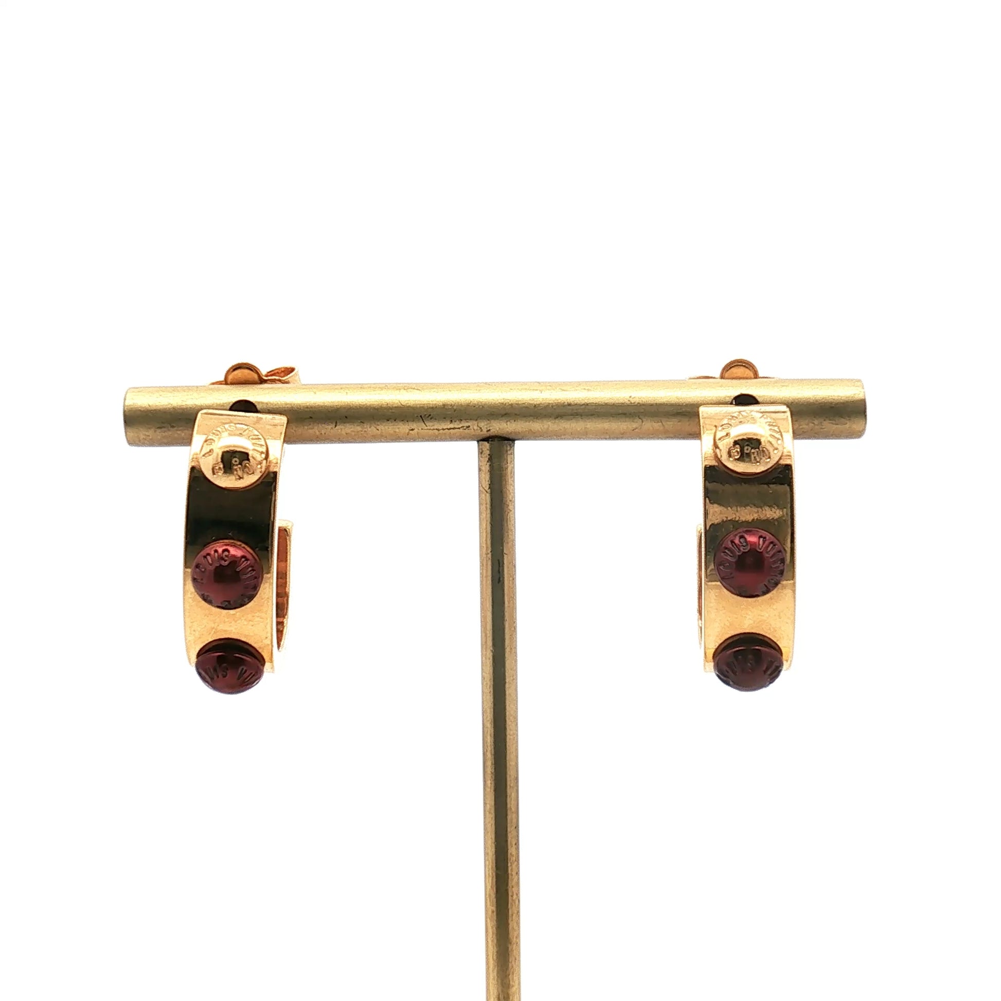 Louis Vuitton gold-tone red resin hoop earrings, jewelry featuring bold circular design with shiny gold finish and vibrant red accents.