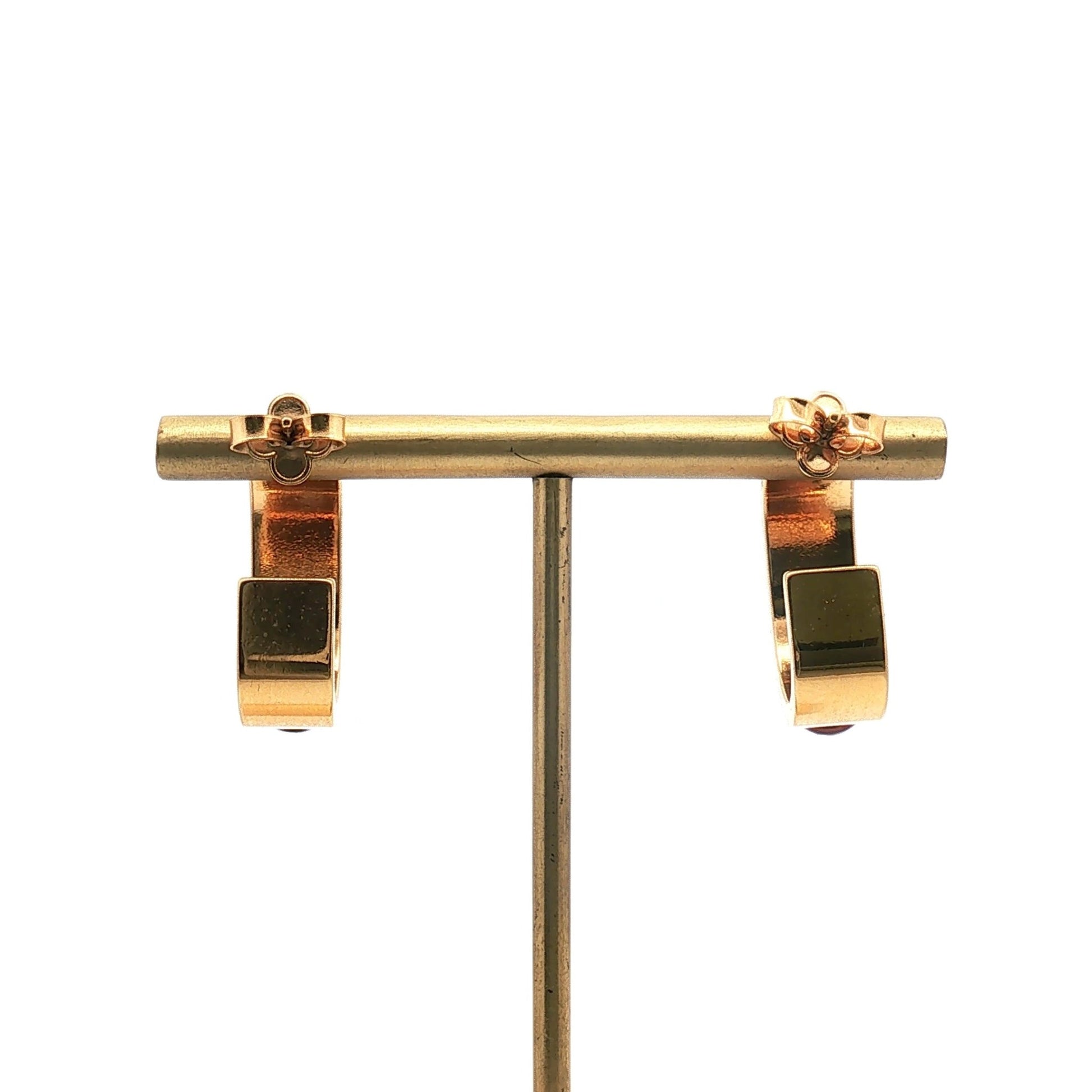 Louis Vuitton gold-tone resin hoop earrings, red jewelry with a sleek, shiny finish, displayed on a white background.