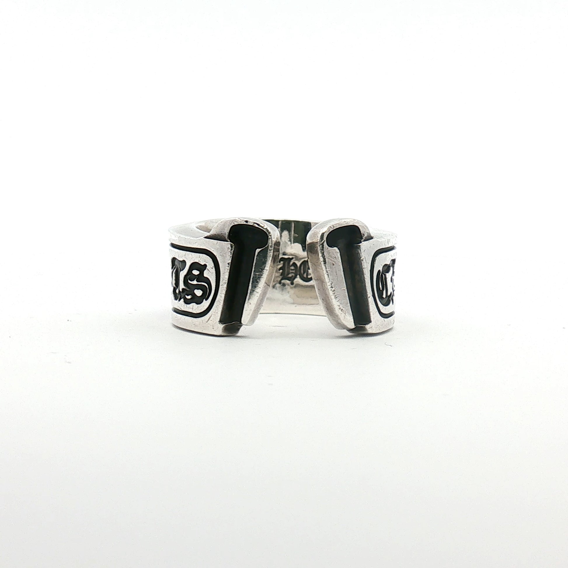 Chrome Hearts Scroll Logo ring in jewelry, featuring intricate scroll design on shiny metal band