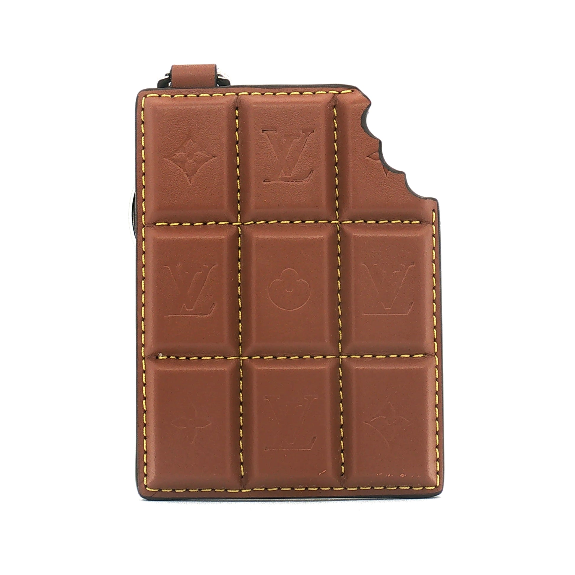 Louis Vuitton chocolate bar bag charm and key holder from Gold & Beyond, stylish accessory with detailed design.