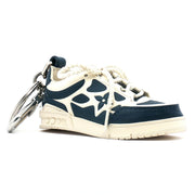 Louis Vuitton LV Trainer sneaker-themed bag charm and key holder by Gold & Beyond, featuring detailed design and high-quality craftsmanship.