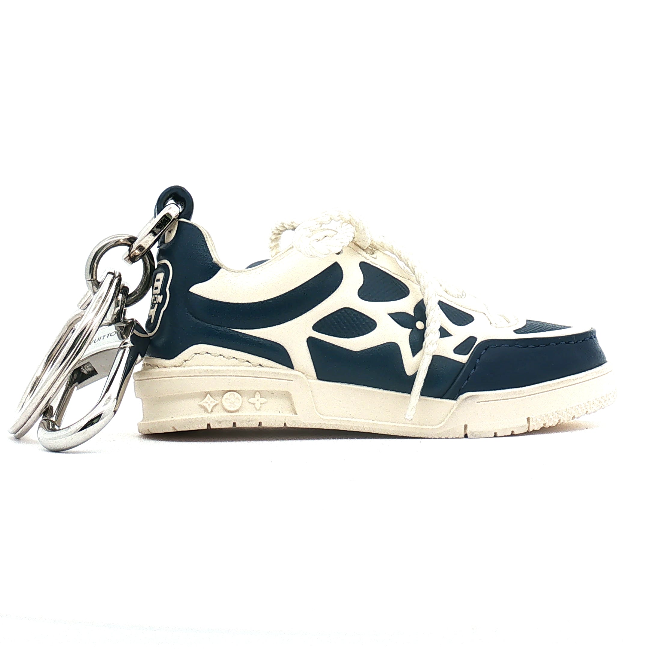 Louis Vuitton LV Trainer sneaker bag charm and key holder with gold accents, accessory for bags and keys by Gold & Beyond.