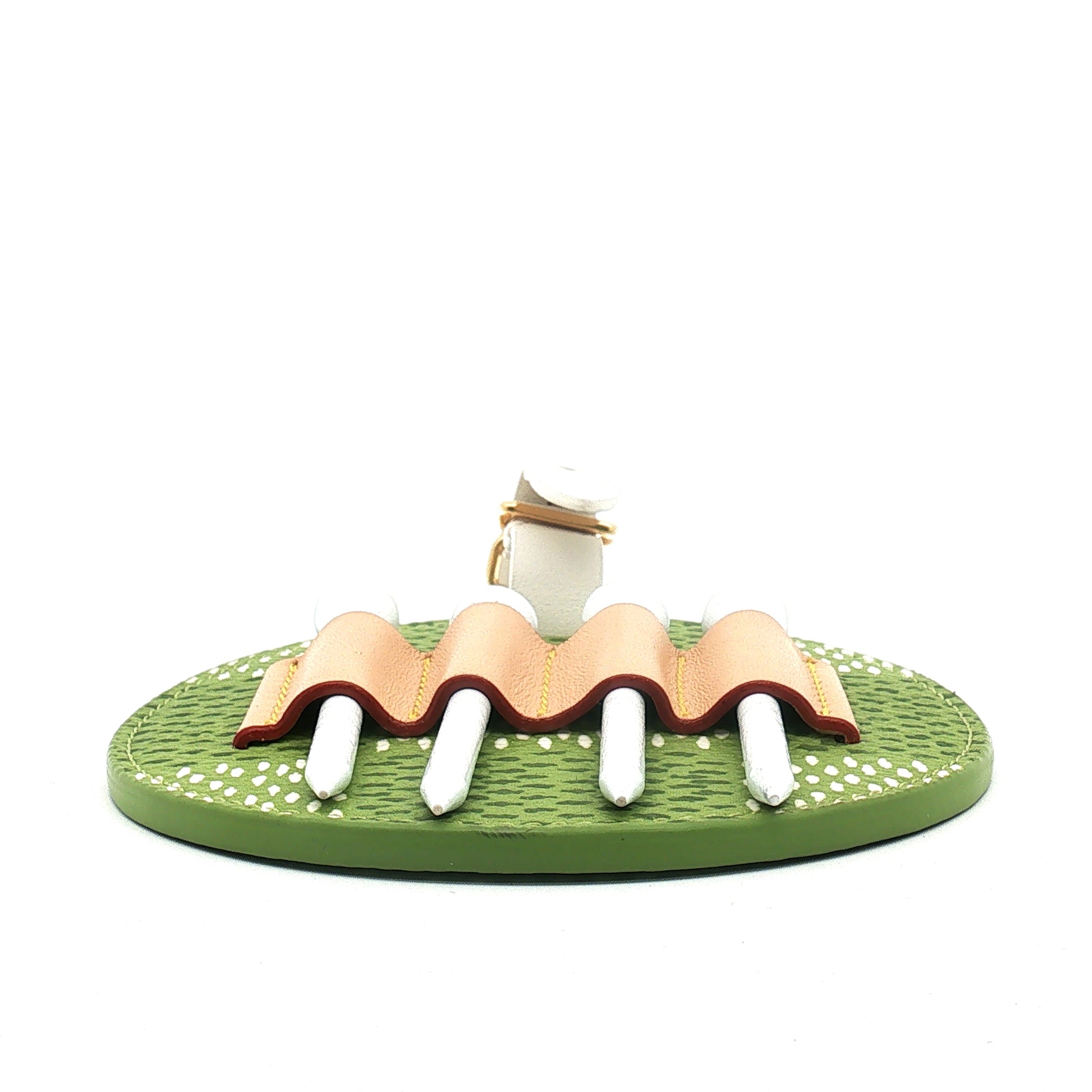 Louis Vuitton Golf Tee Holder Bag Charm by Gold & Beyond, a luxury accessories piece with a stylish logo design and metal details.