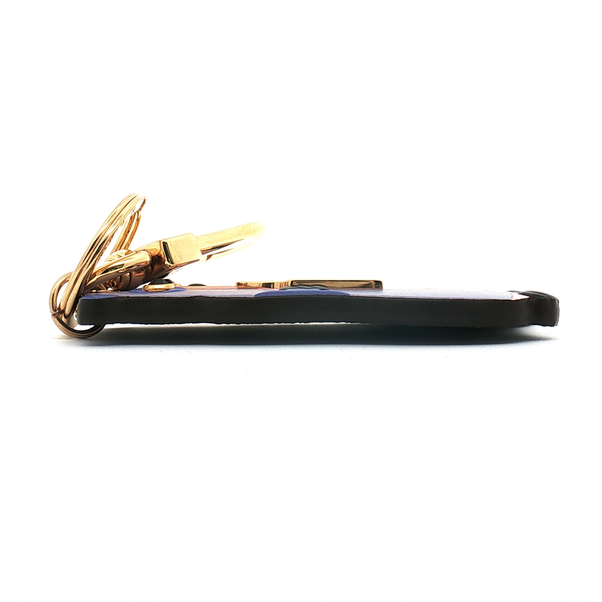 Louis Vuitton LV Marmotte bag charm and key holder, luxury accessories with gold-tone details, featuring the iconic LV logo and playful design.