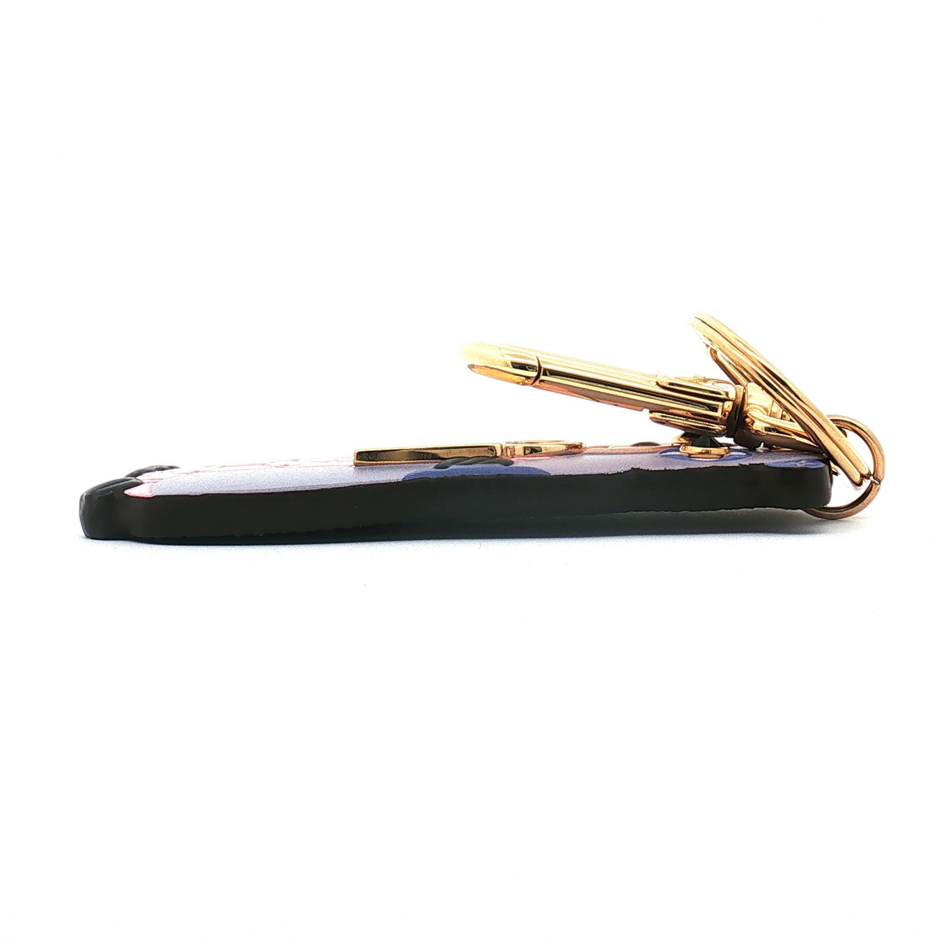 Louis Vuitton LV Marmotte bag charm and key holder with gold accents, stylish accessory for handbags and keys.