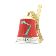 Red porcelain Christmas bell ornament featuring a Bvlgari x Rosenthal musical design, displayed as a decorative holiday accessory.