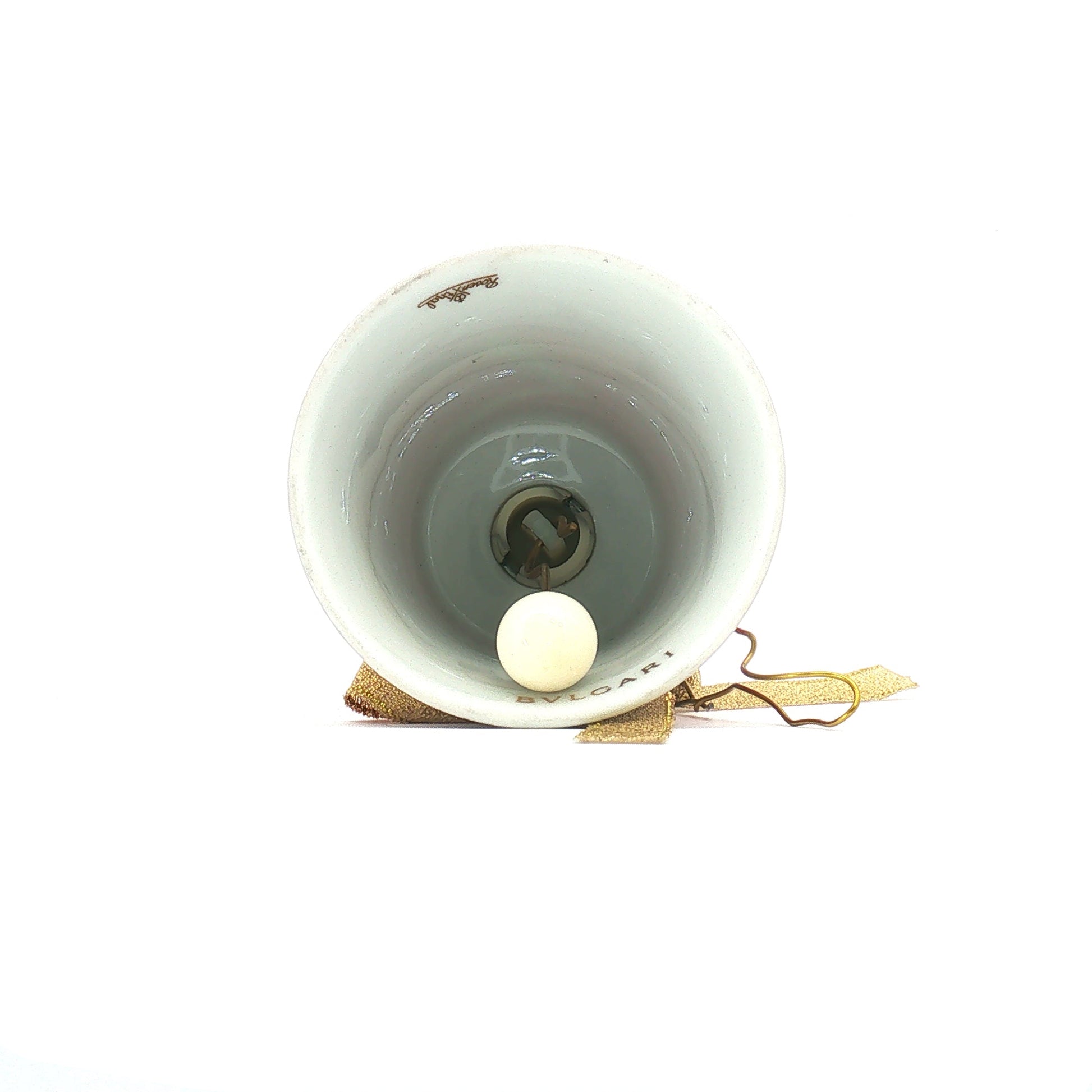 Red porcelain Christmas bell ornament featuring Bvlgari x Rosenthal design, musical accessory with intricate details and festive charm.