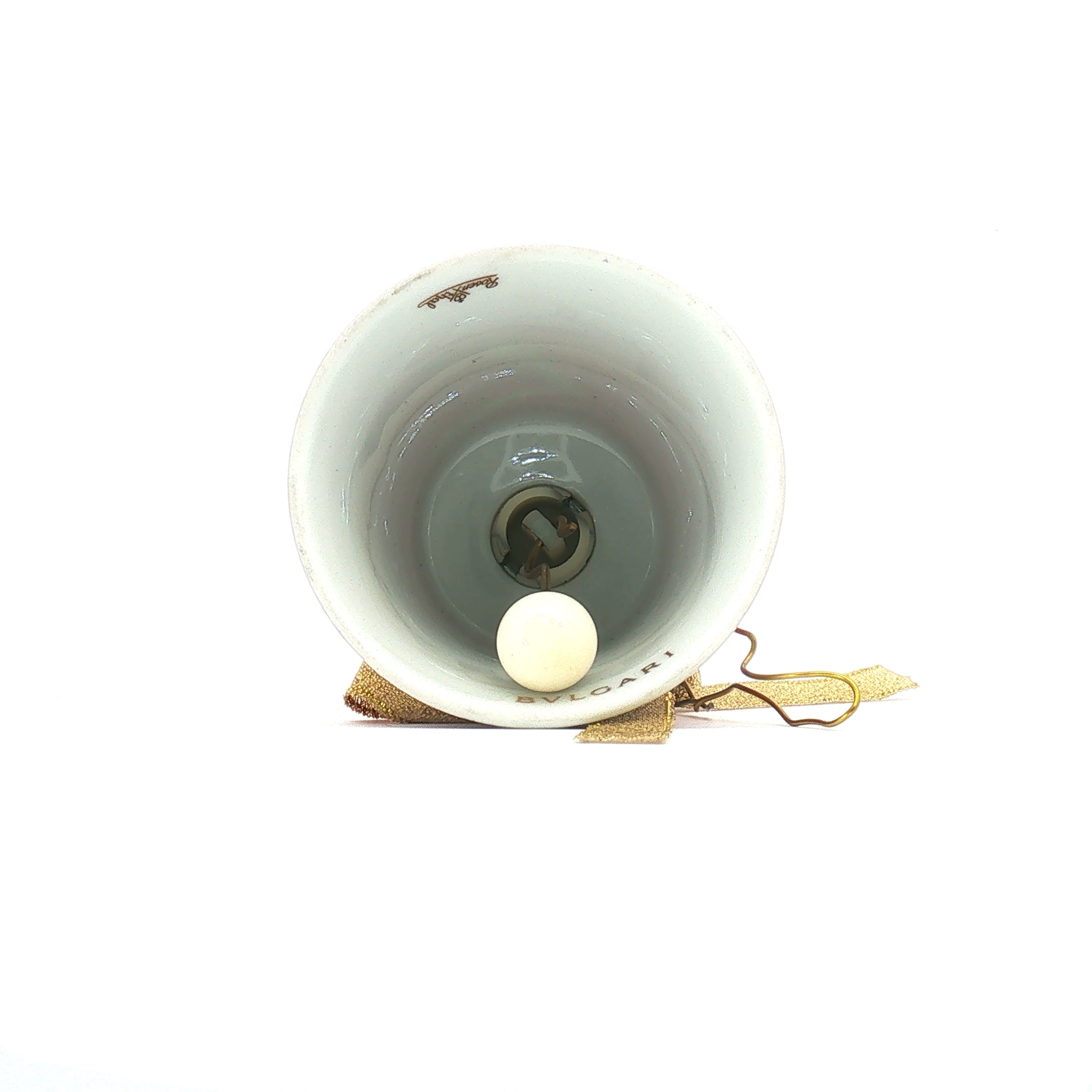 Red porcelain Christmas bell ornament featuring Bvlgari x Rosenthal design, musical accessory with intricate details and festive charm.