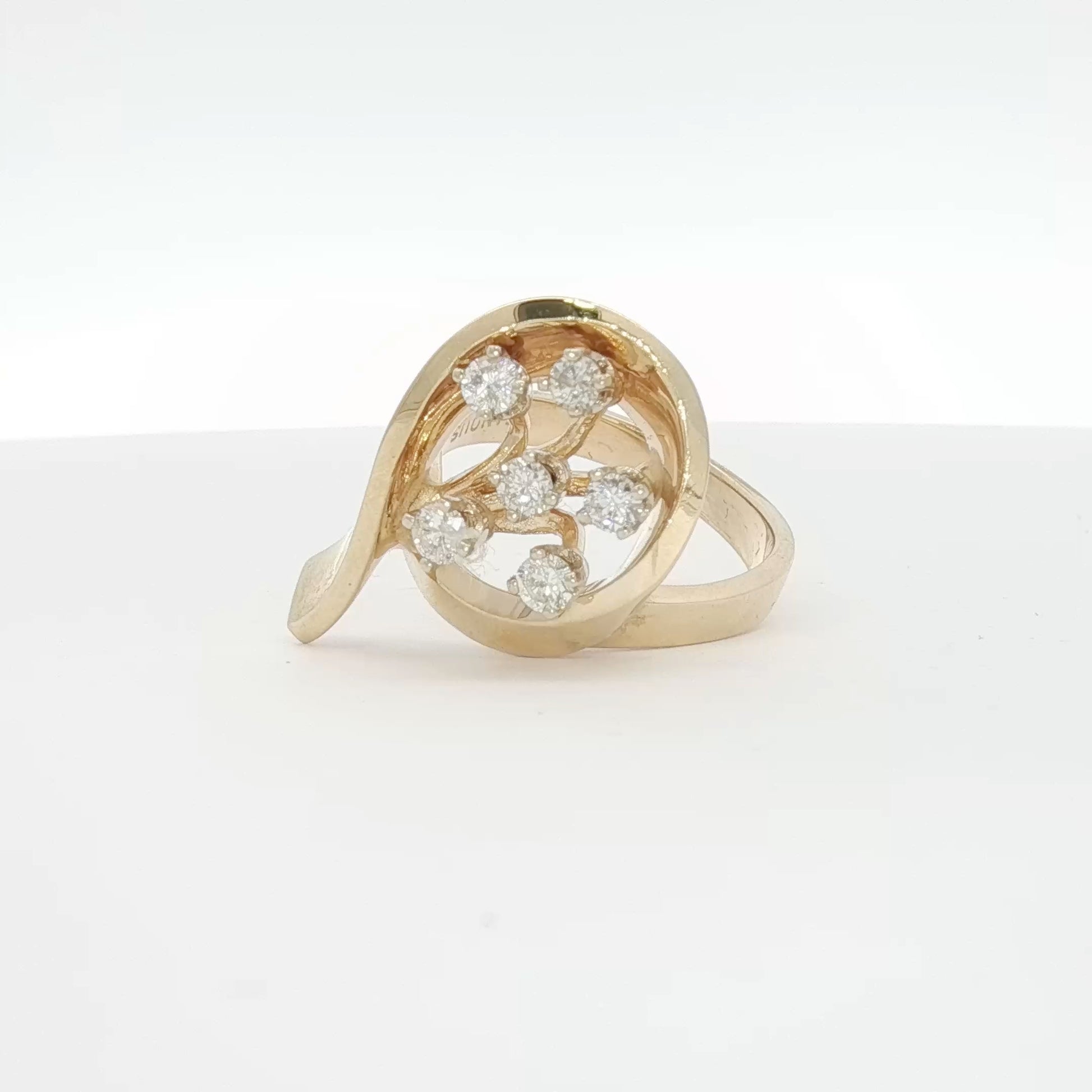 14K yellow gold diamond flower ring with intricate floral design, showcasing sparkling diamonds and elegant craftsmanship.