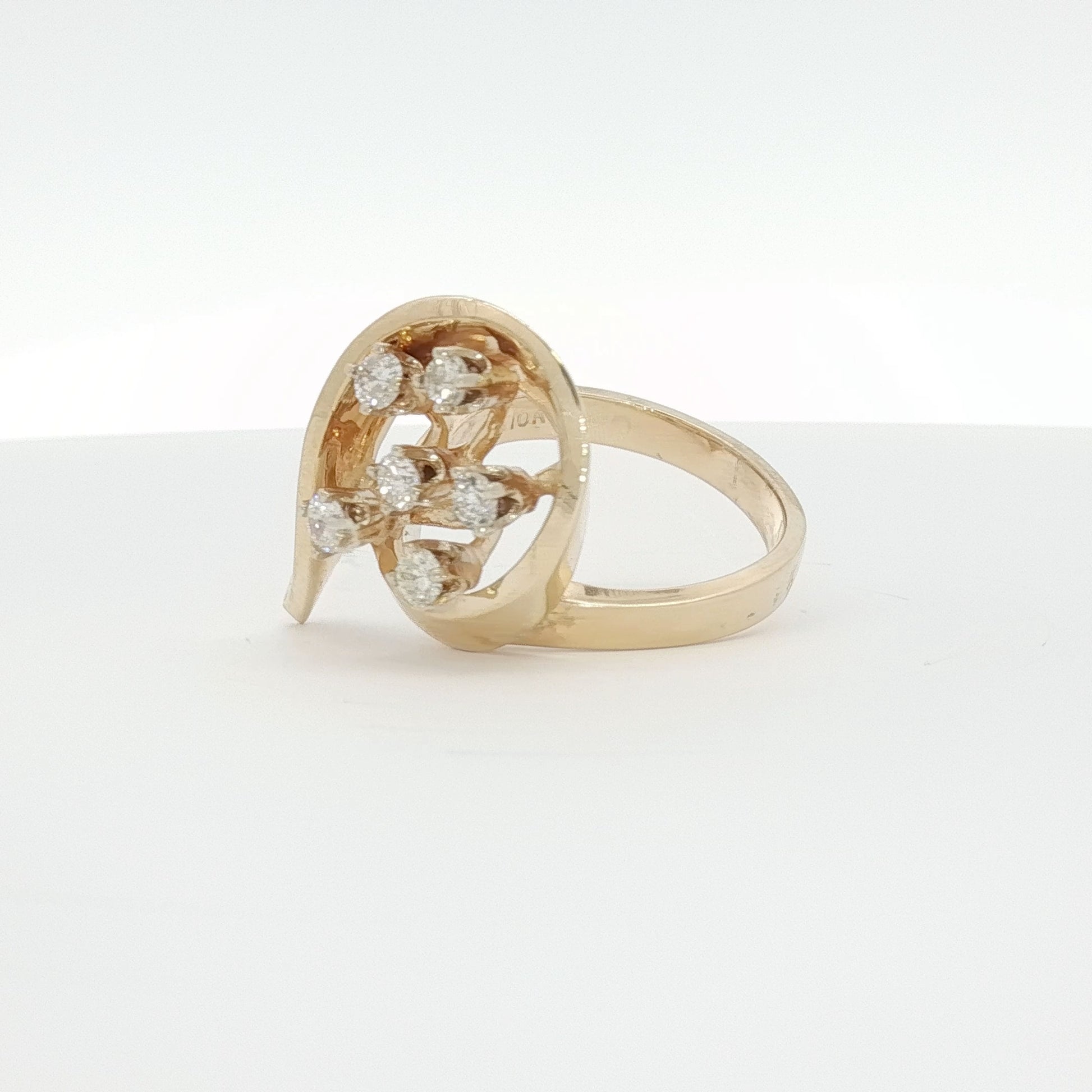 14K yellow gold diamond flower ring, showcasing a delicate floral design with sparkling diamonds in jewelry style.