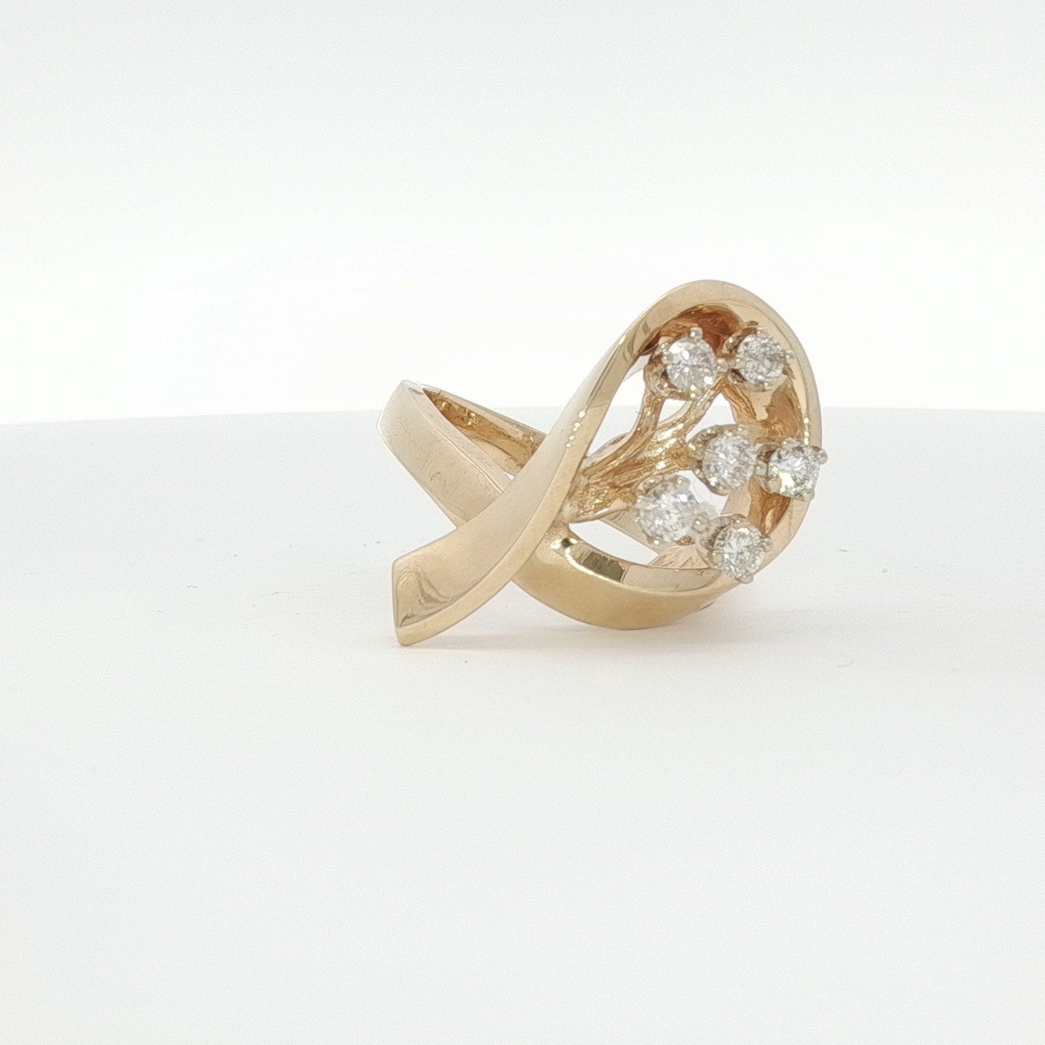 14K yellow gold diamond flower ring with intricate floral design, showcasing sparkling diamonds and elegant jewelry craftsmanship.