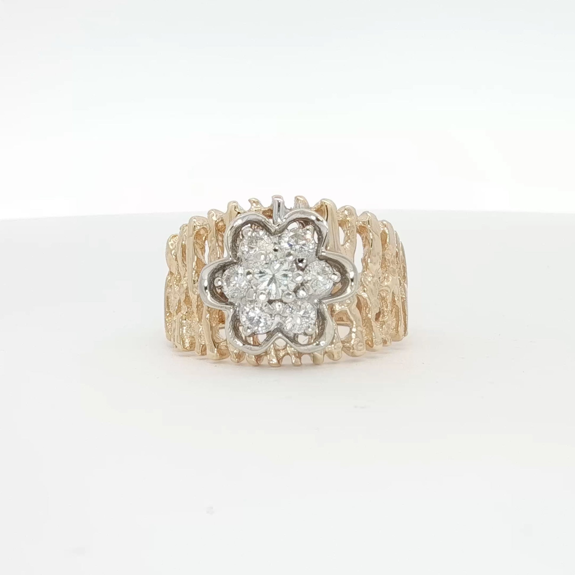 14K yellow gold diamond flower cluster ring with intricate floral design, showcasing sparkling diamonds and fine craftsmanship.
