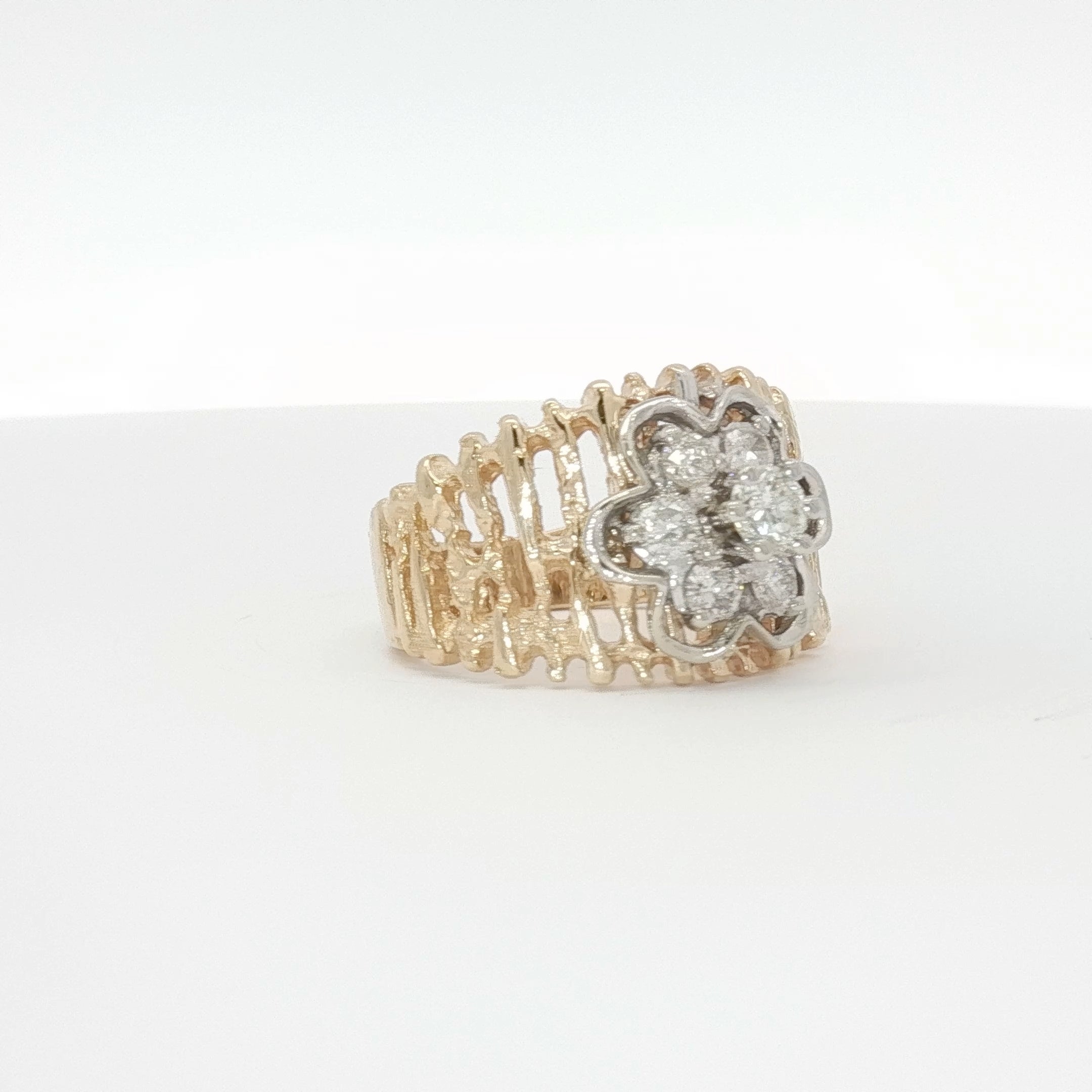 14K yellow gold diamond flower cluster ring with intricate design, showcasing sparkling diamonds in a floral pattern.