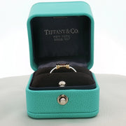 Two-tone Tiffany & Co. sterling silver and 18K gold Ruby ring with a polished finish, showcasing elegant jewelry craftsmanship.