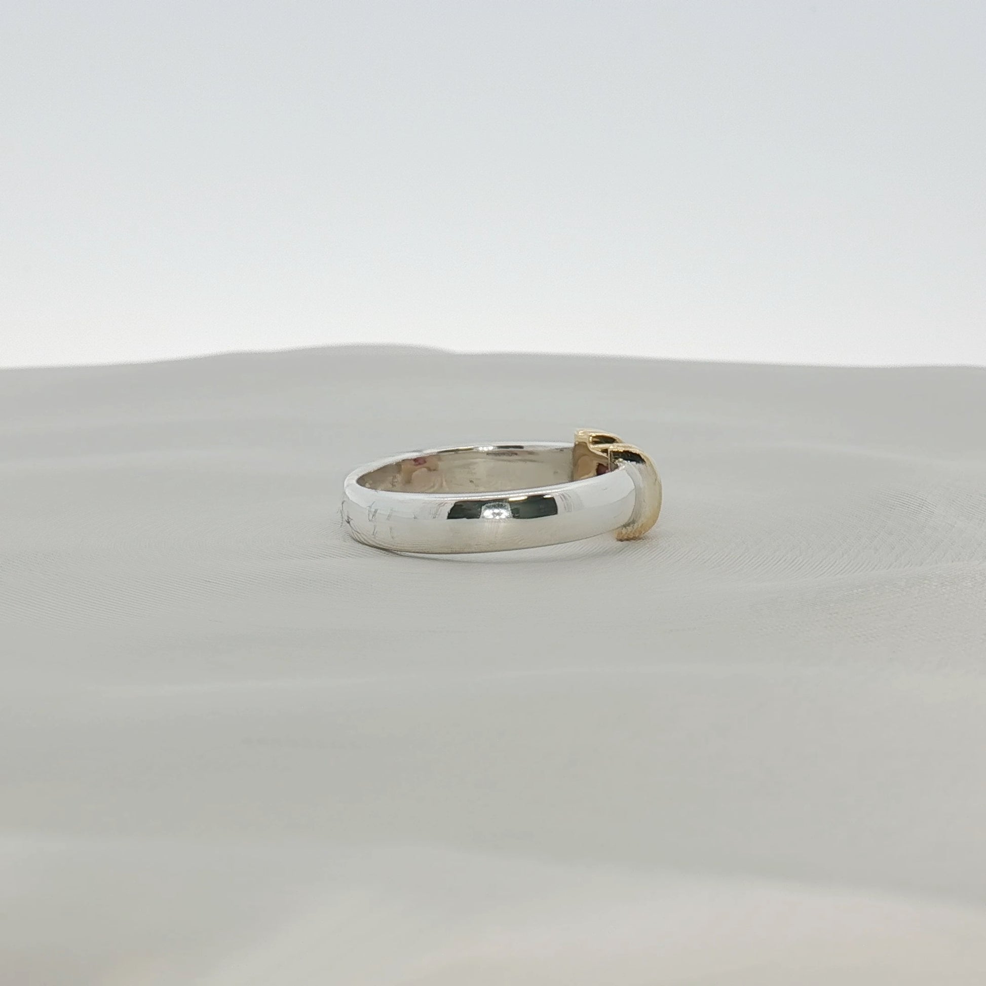 Two-tone sterling silver and 18K gold Ruby ring from Tiffany & Co. jewelry collection with a polished finish and intricate design