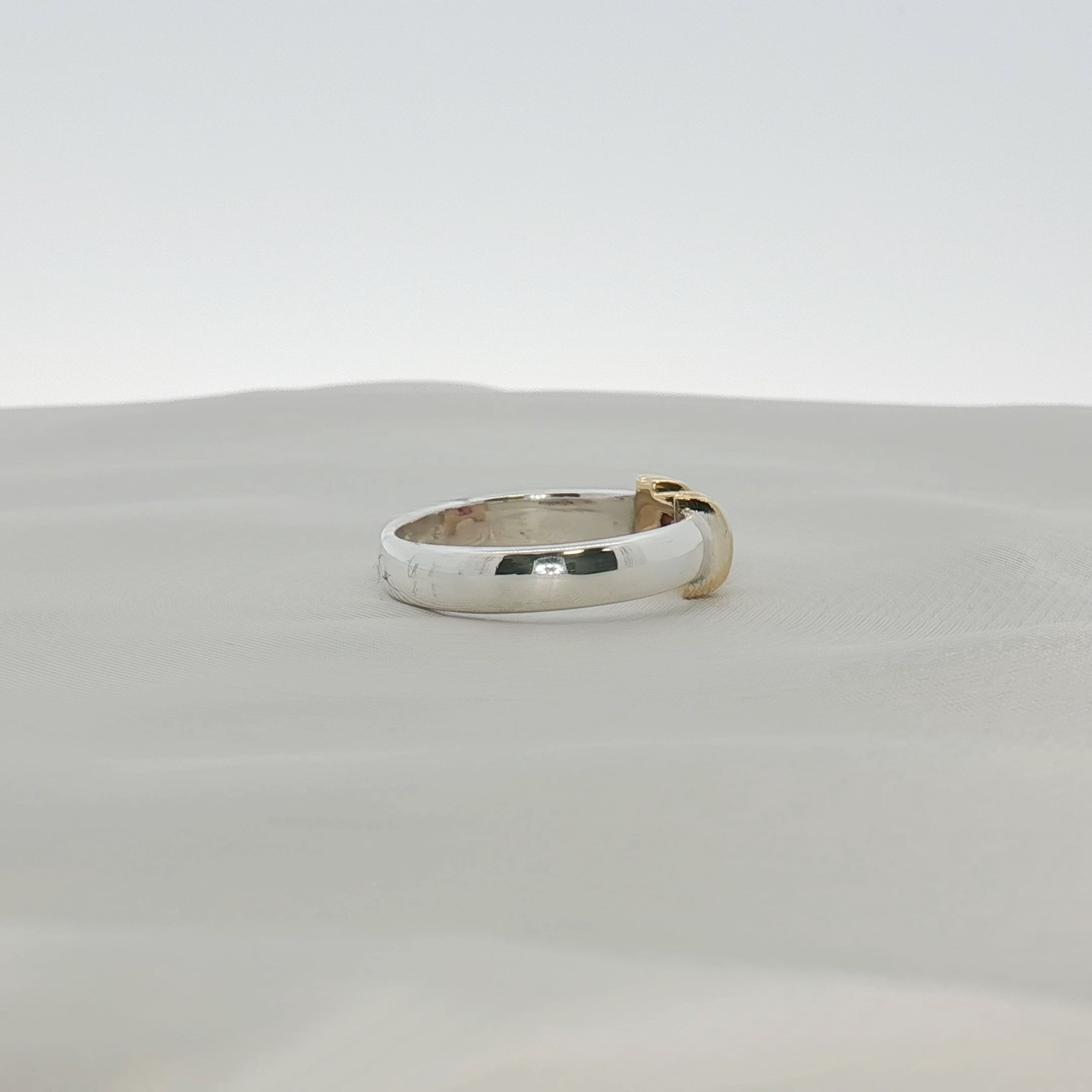 Two-tone sterling silver and 18K gold Ruby ring from Tiffany & Co. jewelry collection with a polished finish and intricate design