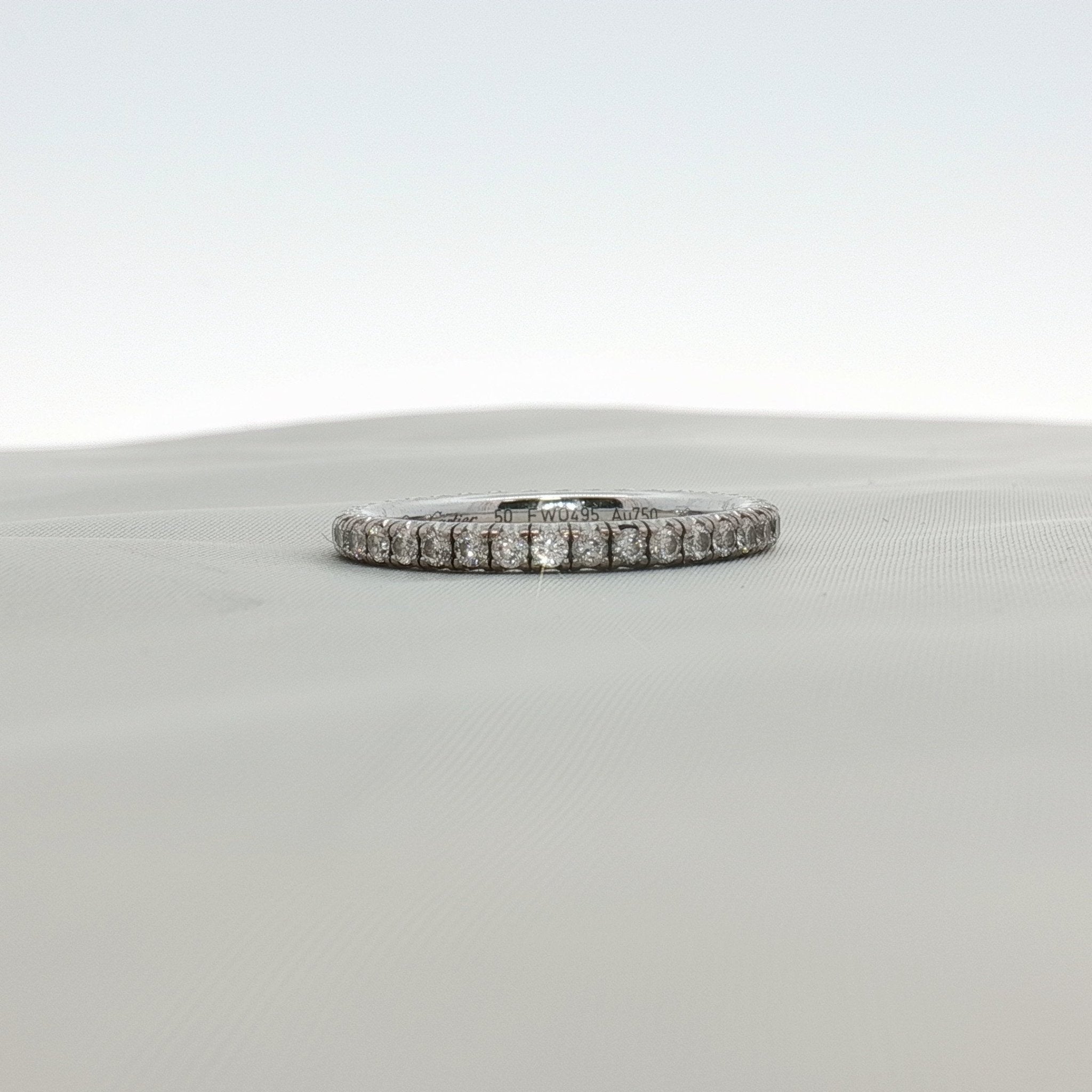 Cartier Love Eternity diamond band ring with multiple sparkling diamonds, crafted for elegant jewelry style.